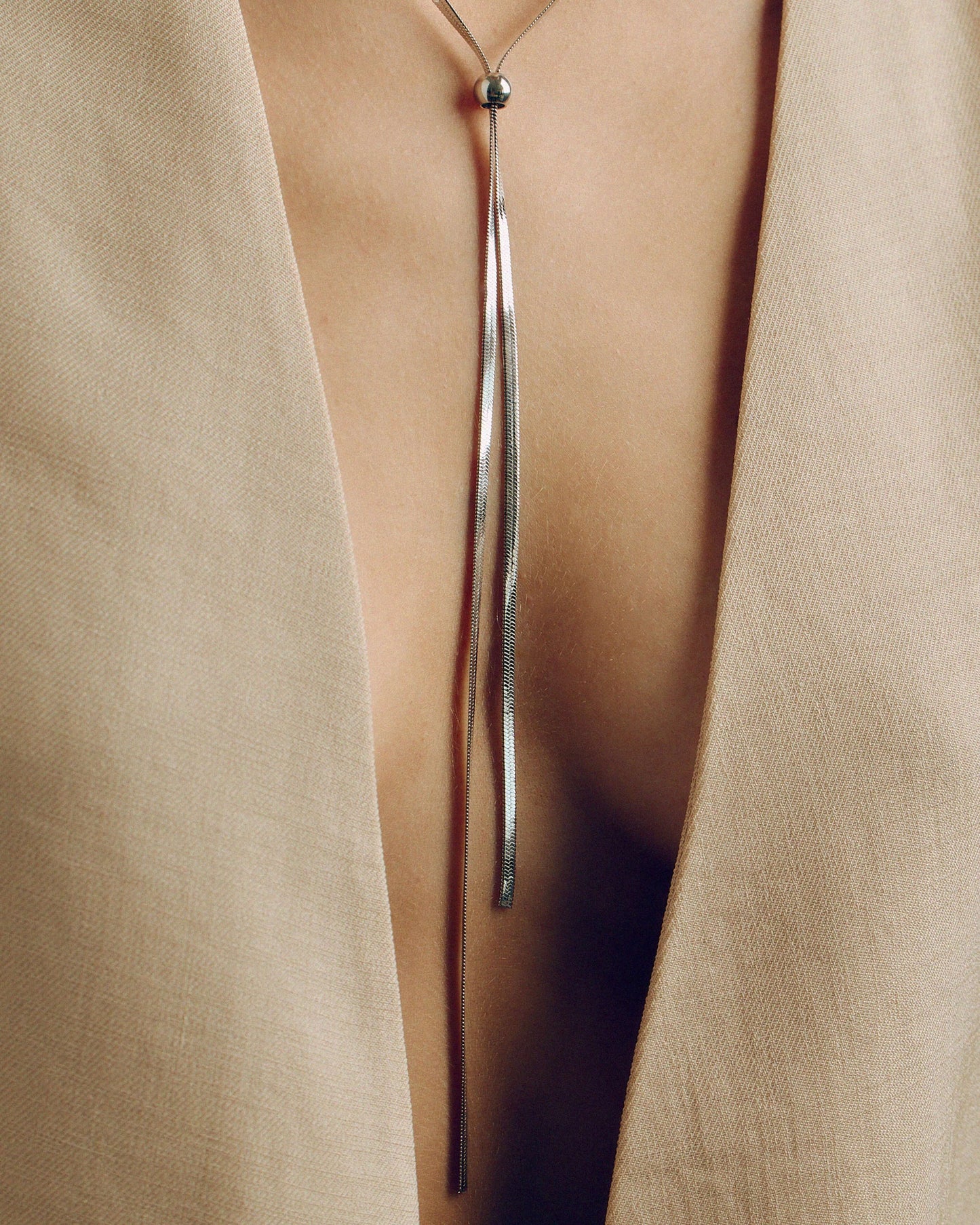 Adjustable gold or silver necklace worn long or as a choker, non-tarnish finish, versatile for layering or statement looks.