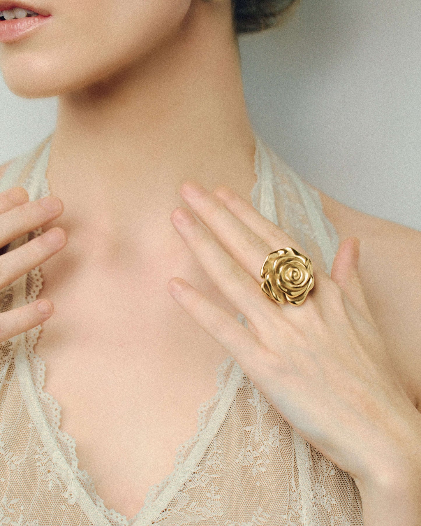 Oversized gold rose ring with sculpted layered petals in a realistic blooming flower design. Bold statement ring with a shiny polished finish, adding elegance and drama to any outfit. Perfect for floral jewelry lovers looking for a standout piece for everyday wear, events, or special occasions.
