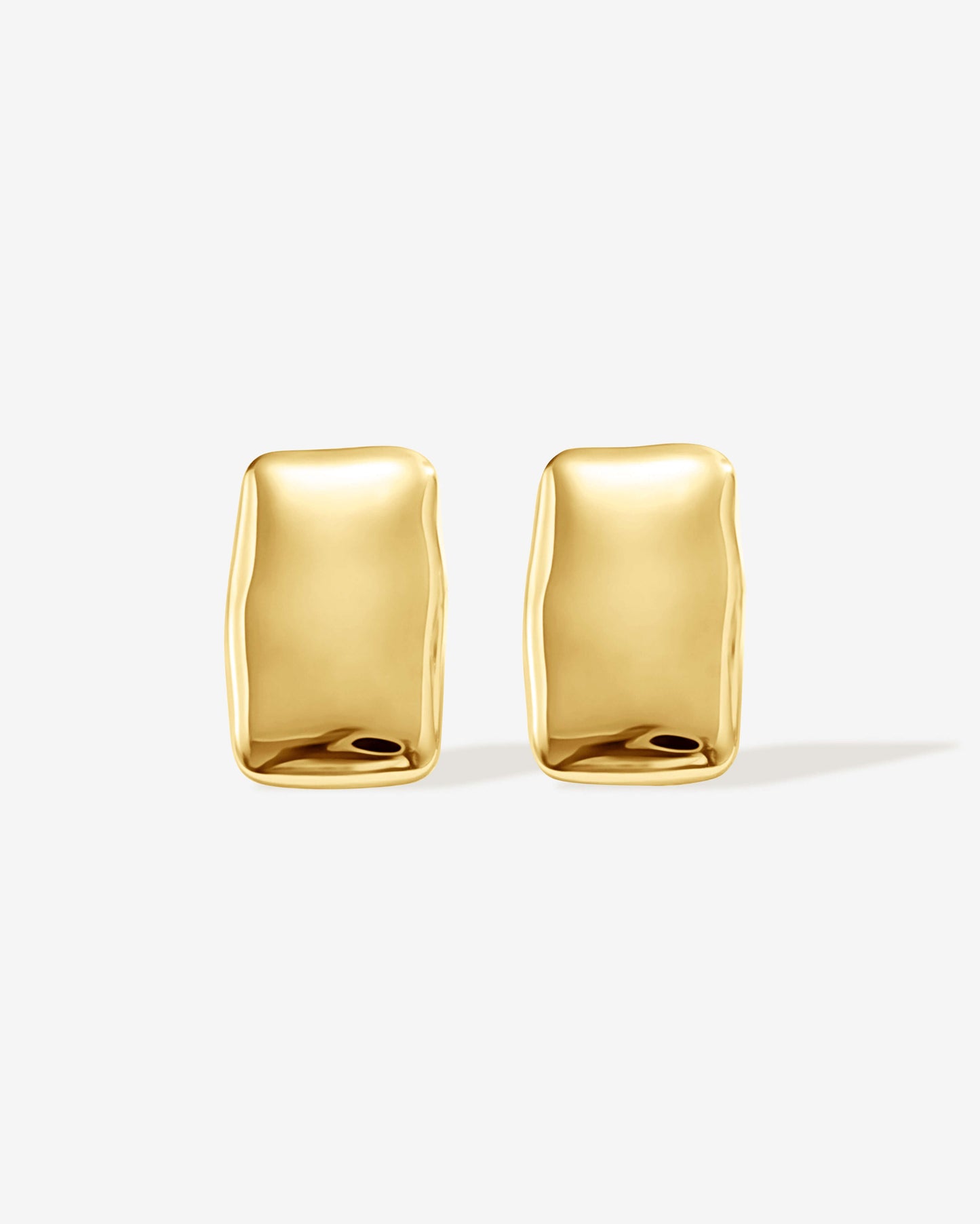 Bold gold rectangle stud earrings with a chunky, sculptural design and high-shine finish. Modern geometric statement studs perfect for everyday or occasion wear.
