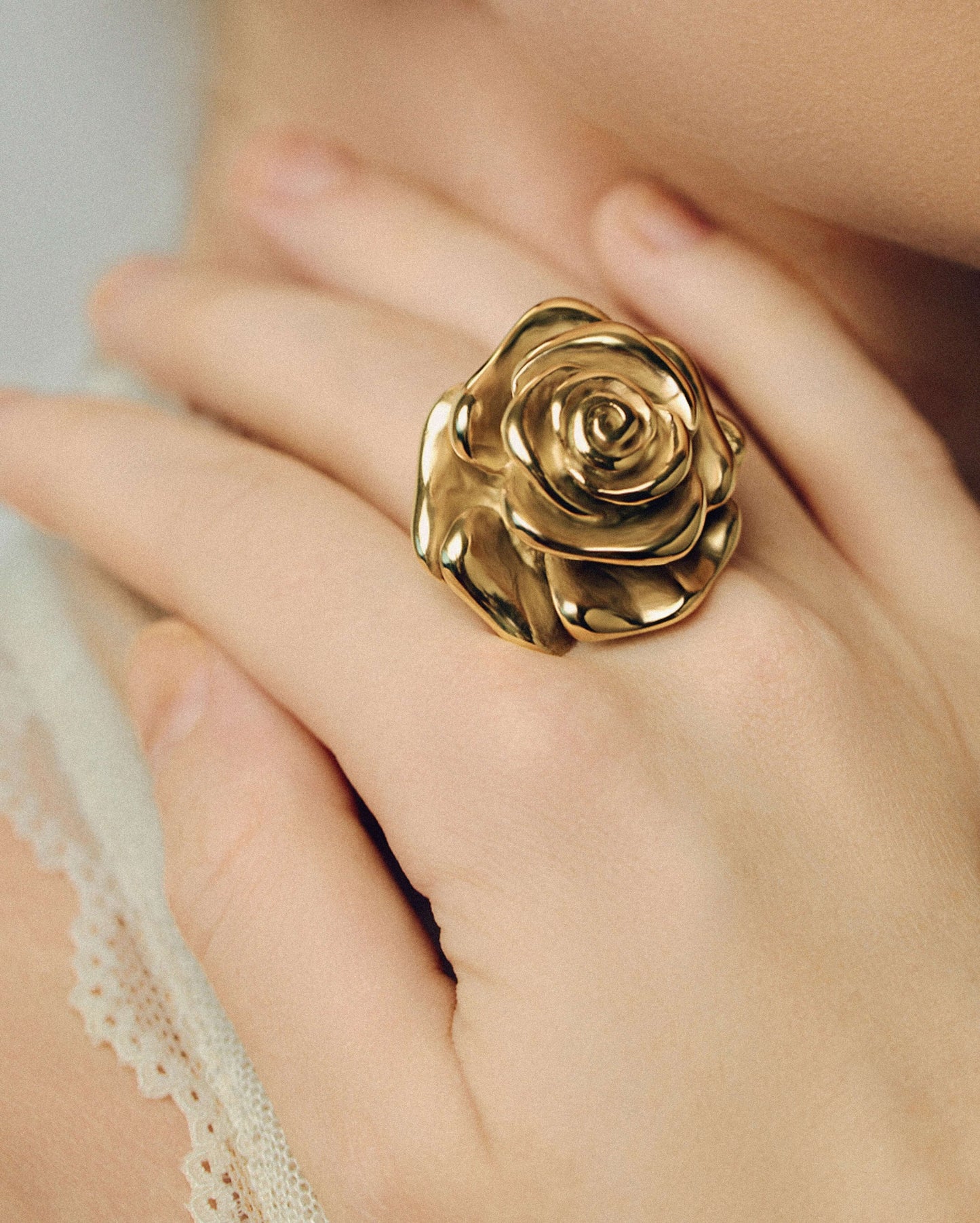 Oversized gold rose ring with sculpted layered petals in a realistic blooming flower design. Bold statement ring with a shiny polished finish, adding elegance and drama to any outfit. Perfect for floral jewelry lovers looking for a standout piece for everyday wear, events, or special occasions.