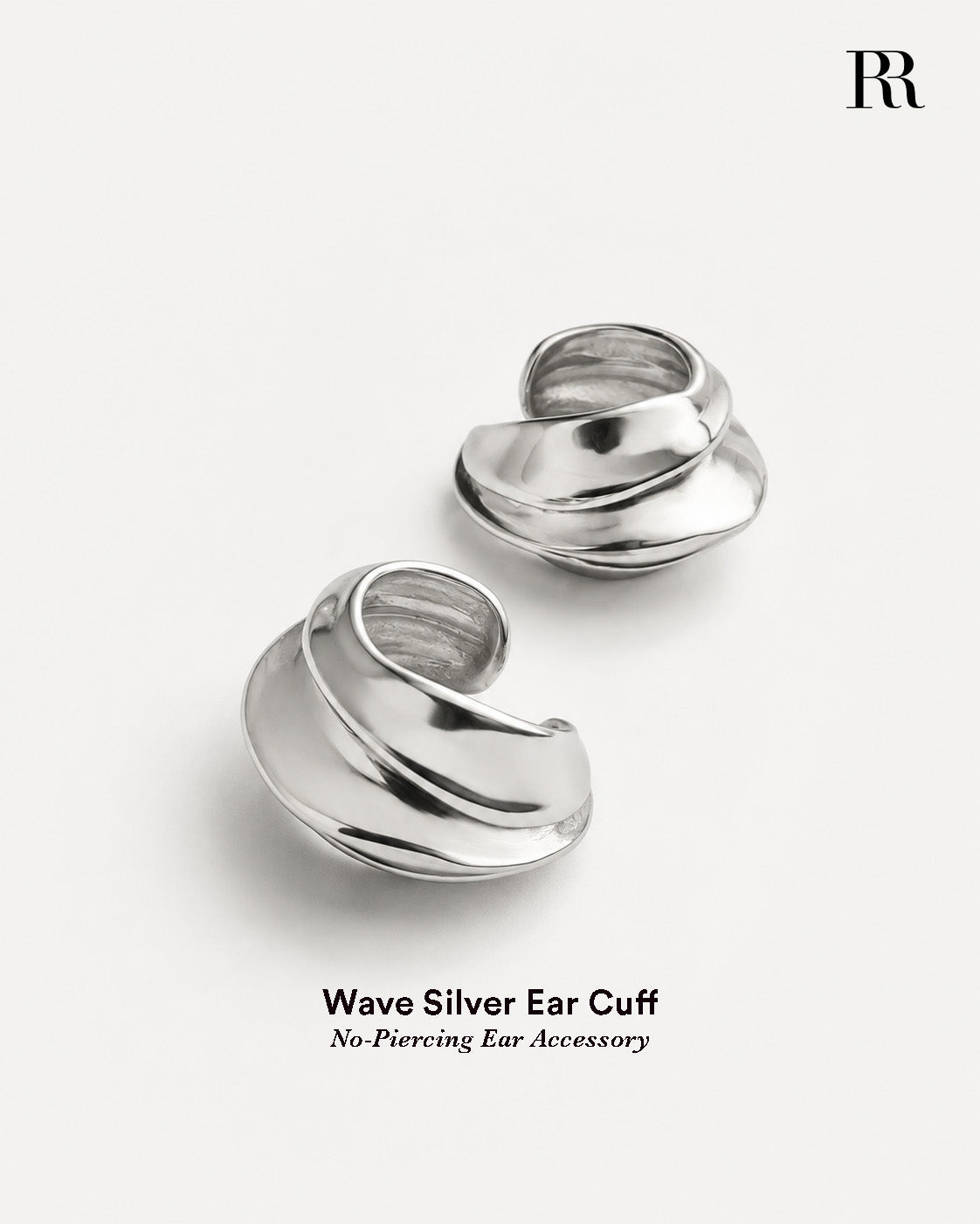 Silver ear cuff abstract statement jewelry with fluid curved dome shape and polished silver finish
