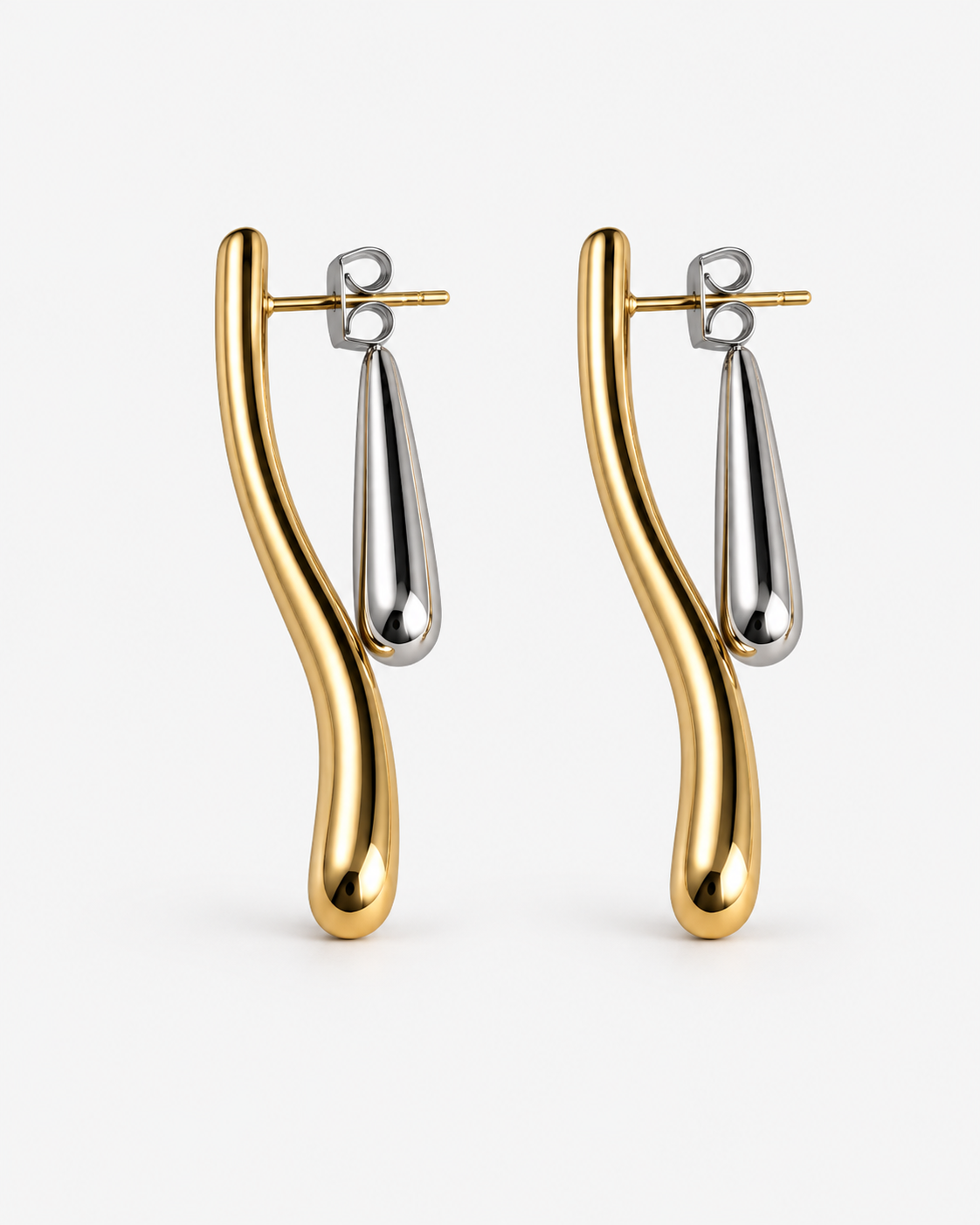 Two tone ear jacket earrings in polished gold and silver with sculptural curved bars, teardrop drop details and a modern mixed metal statement design by RRule