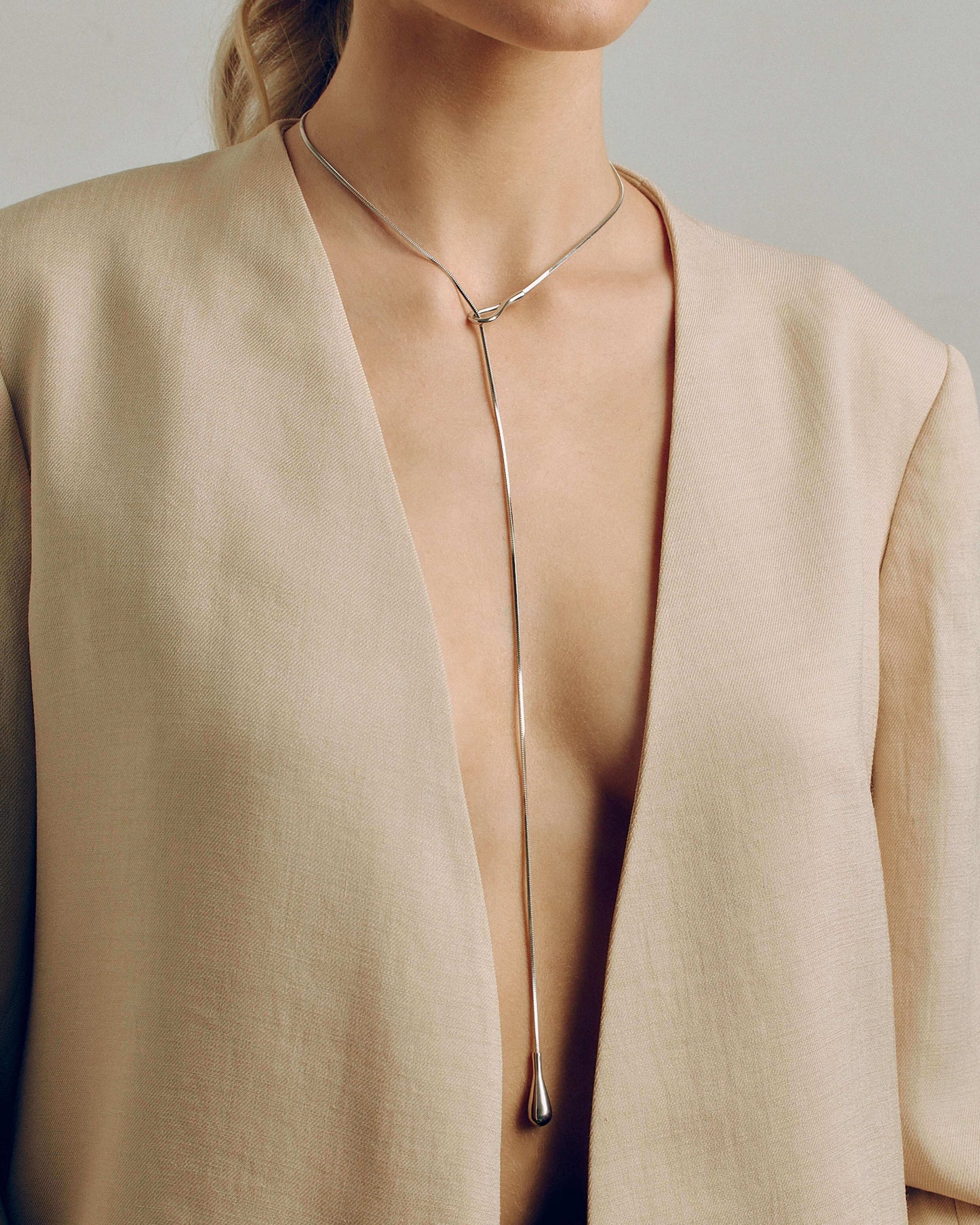 Adjustable gold or silver necklace worn long or as a choker, non-tarnish finish, versatile for layering or statement looks.