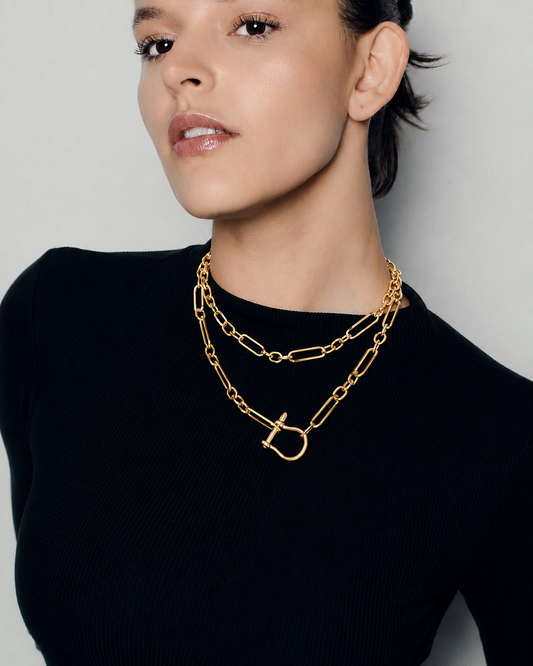 Long link chain toggle necklace in polished gold featuring elongated open links, sculptural horseshoe toggle clasp and versatile long or doubled styling by RRule