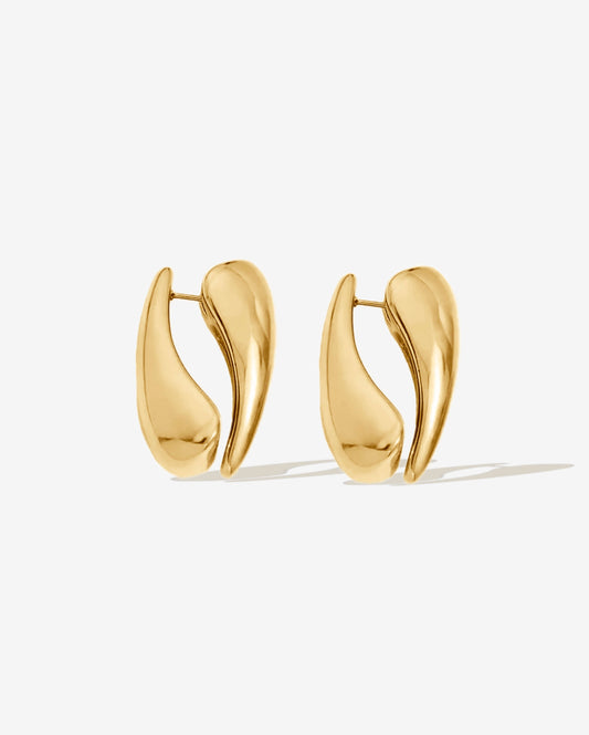 Gold hoop earrings with a modern sculptural shape. Made with two sides for a bold look, or wear as a single-side hoop for a simple style. High-shine finish, lightweight, and easy to wear day or night.