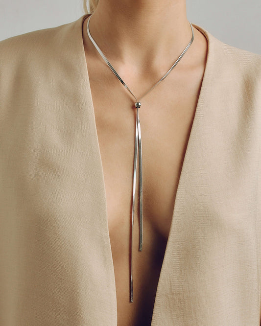 Adjustable gold or silver necklace worn long or as a choker, non-tarnish finish, versatile for layering or statement looks.