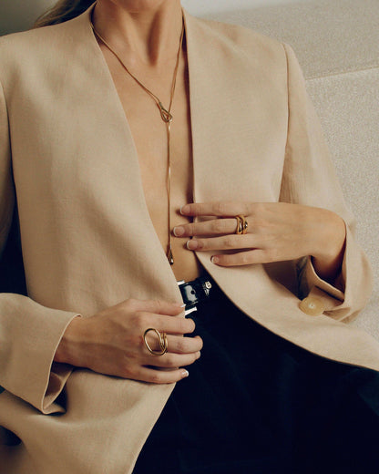 Adjustable gold or silver necklace worn long or as a choker, non-tarnish finish, versatile for layering or statement looks.