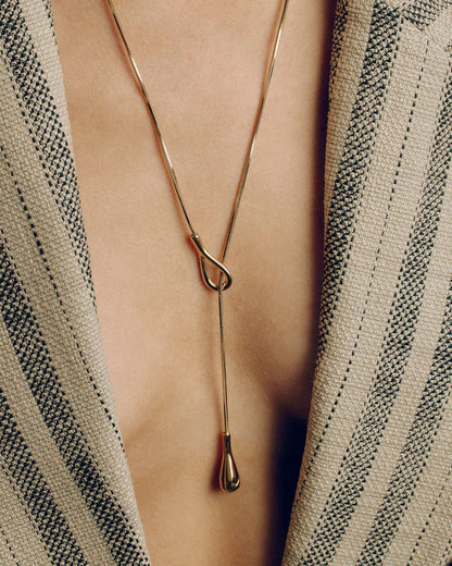 Adjustable gold or silver necklace worn long or as a choker, non-tarnish finish, versatile for layering or statement looks.