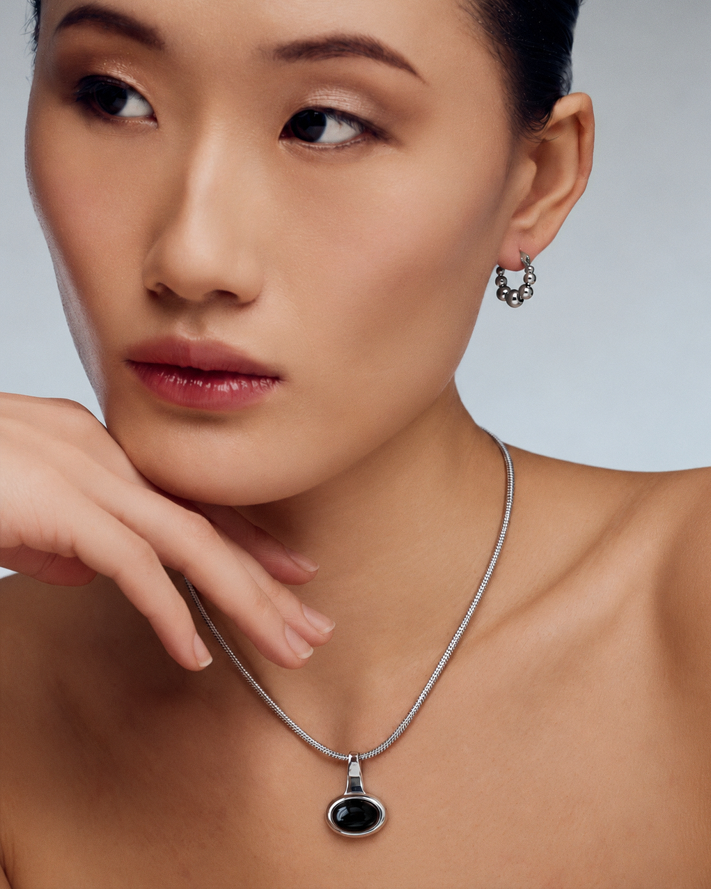 Black Onyx Pendant Necklace in gold or silver with round black stone pendant and sleek snake chain, modern sculptural statement jewelry for women