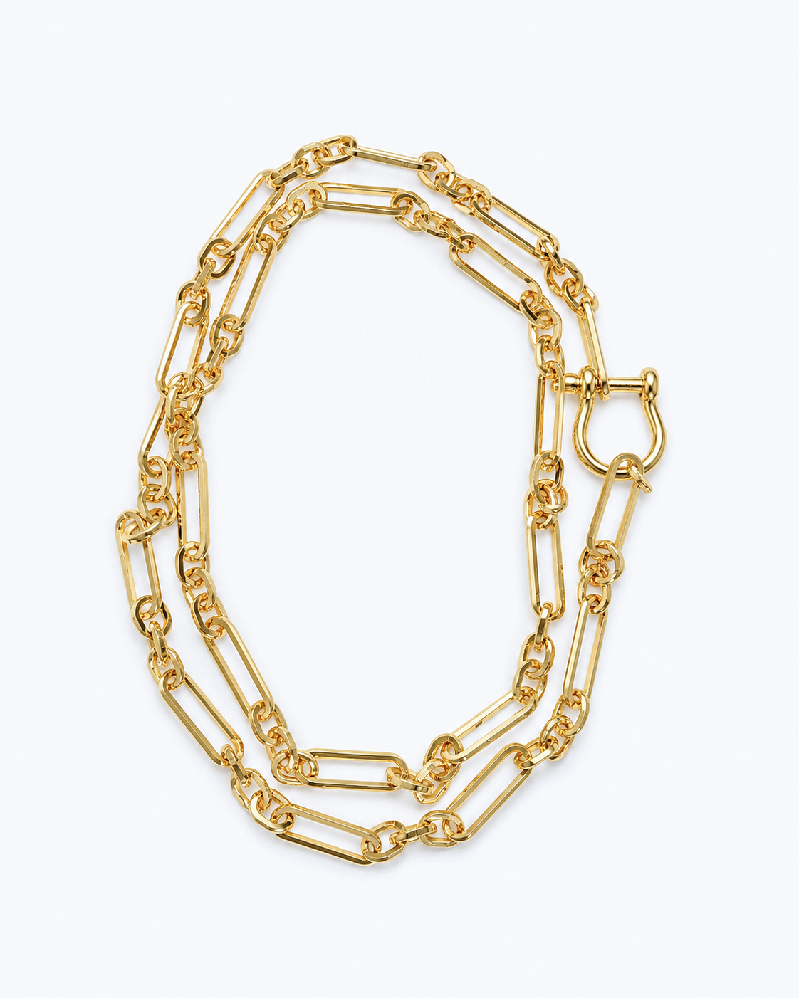 A gold-toned double-strand chain necklace with elongated links, displayed on a clean white background.