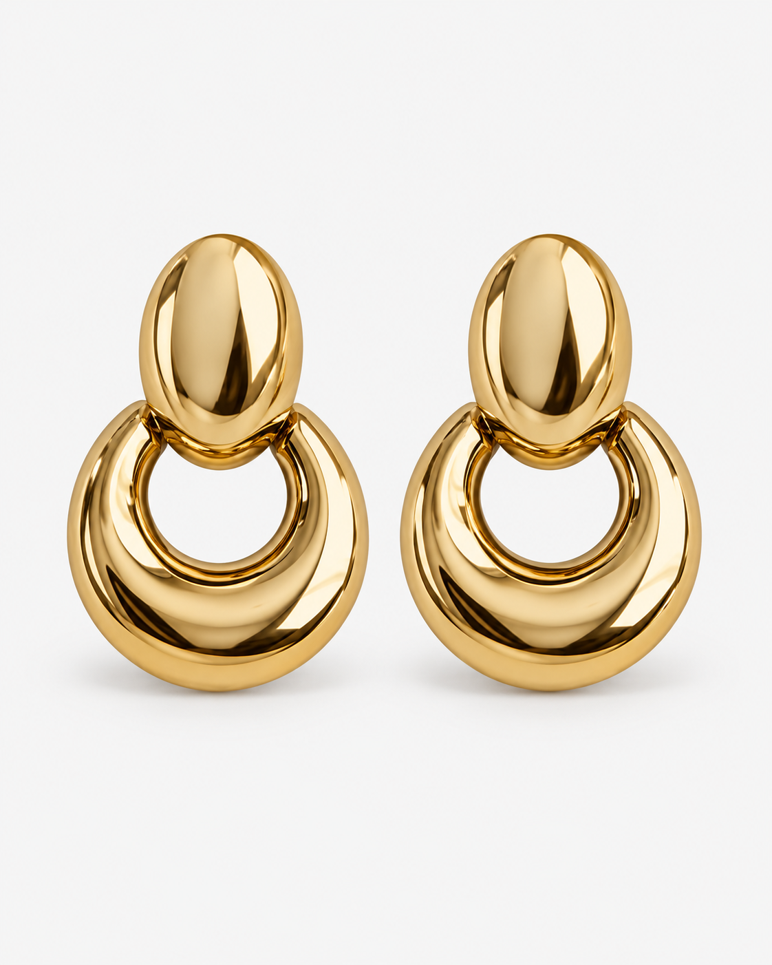 Chunky oval drop earrings in gold and silver, polished statement earrings with a sculptural open hoop design, modern bold jewelry by RRule