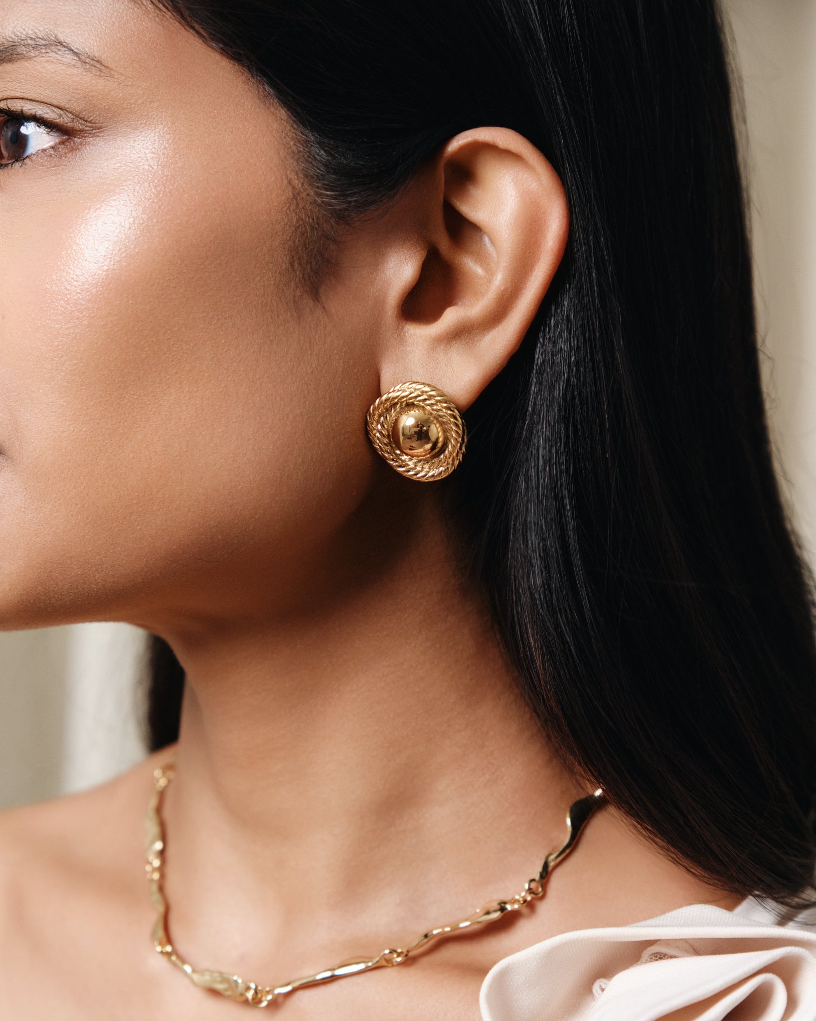 Gold rope dome stud earrings with textured twisted border and polished finish