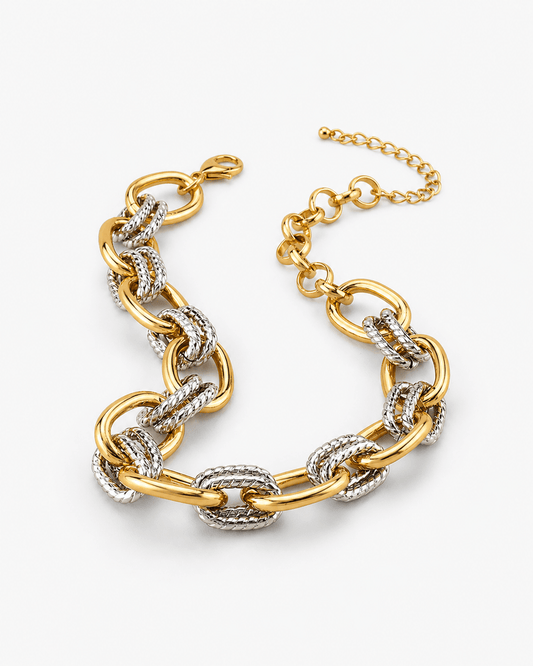 Gold and silver chain necklace on a white background