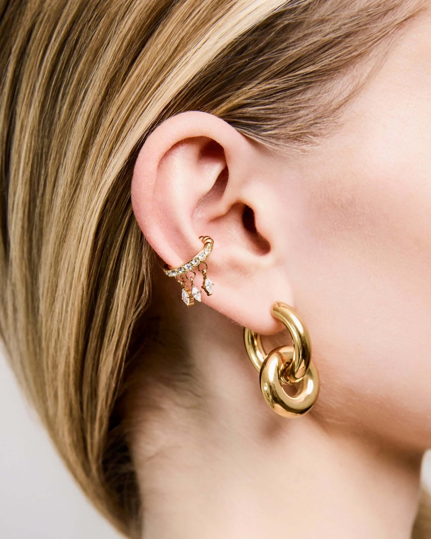 Gold CZ crystal ear cuff with dangling marquise crystal charms, elegant no piercing ear cuff for women, sparkling statement ear jewelry, trendy gold ear wrap, minimalist crystal cuff for everyday or party wear