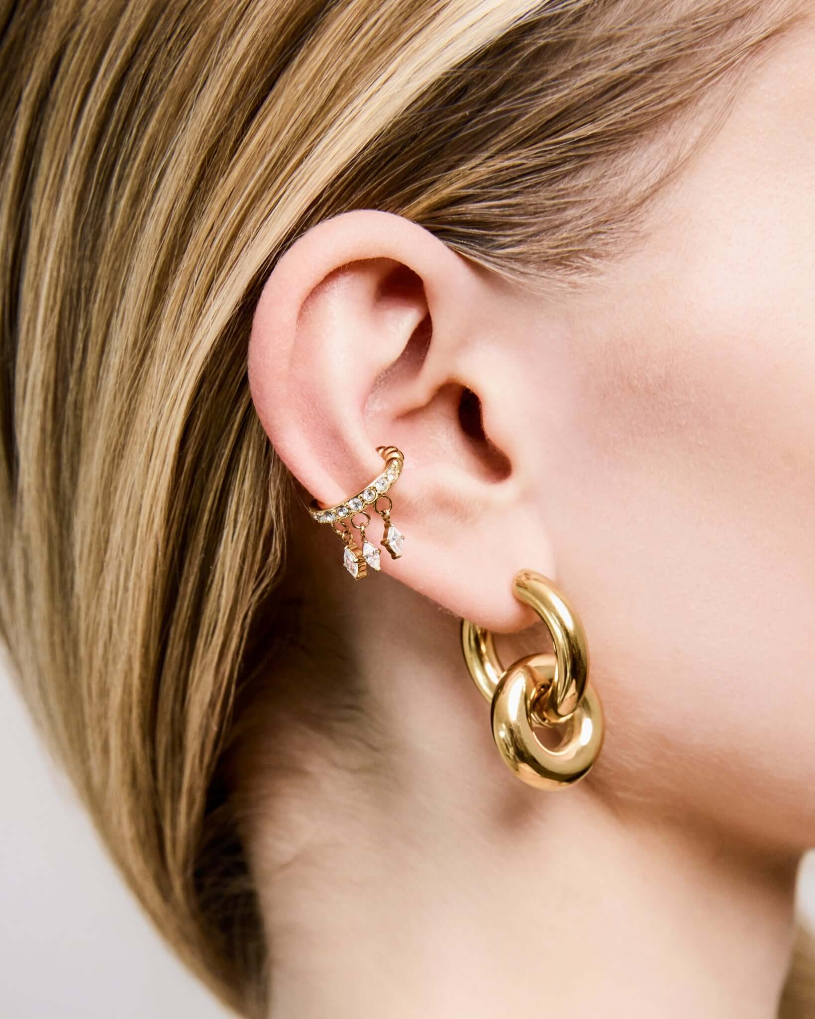 Gold CZ crystal ear cuff with dangling marquise crystal charms, elegant no piercing ear cuff for women, sparkling statement ear jewelry, trendy gold ear wrap, minimalist crystal cuff for everyday or party wear