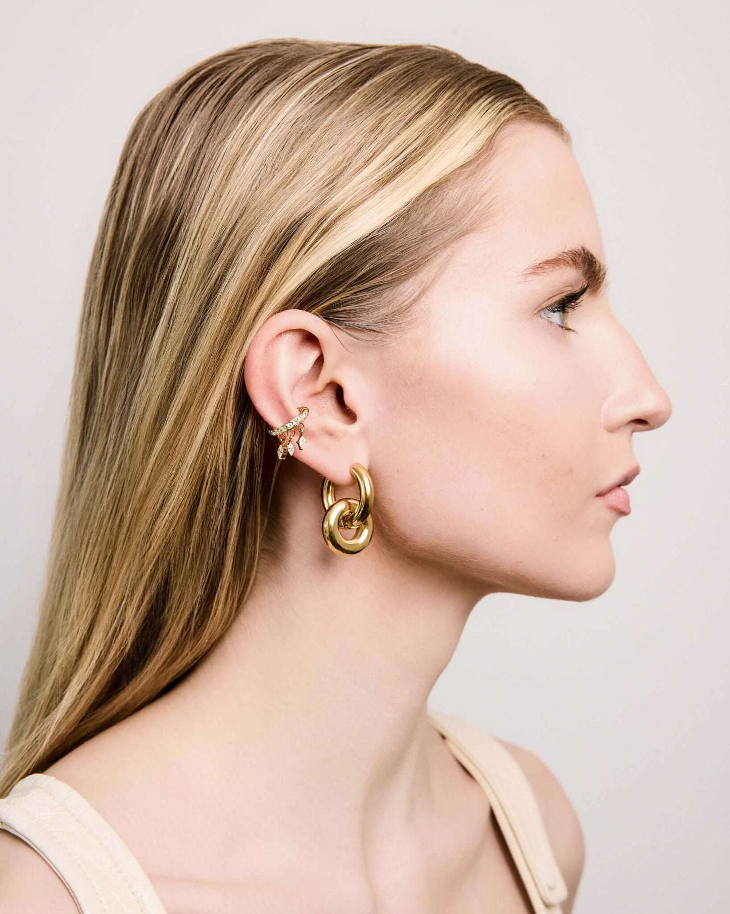 Gold CZ crystal ear cuff with dangling marquise crystal charms, elegant no piercing ear cuff for women, sparkling statement ear jewelry, trendy gold ear wrap, minimalist crystal cuff for everyday or party wear