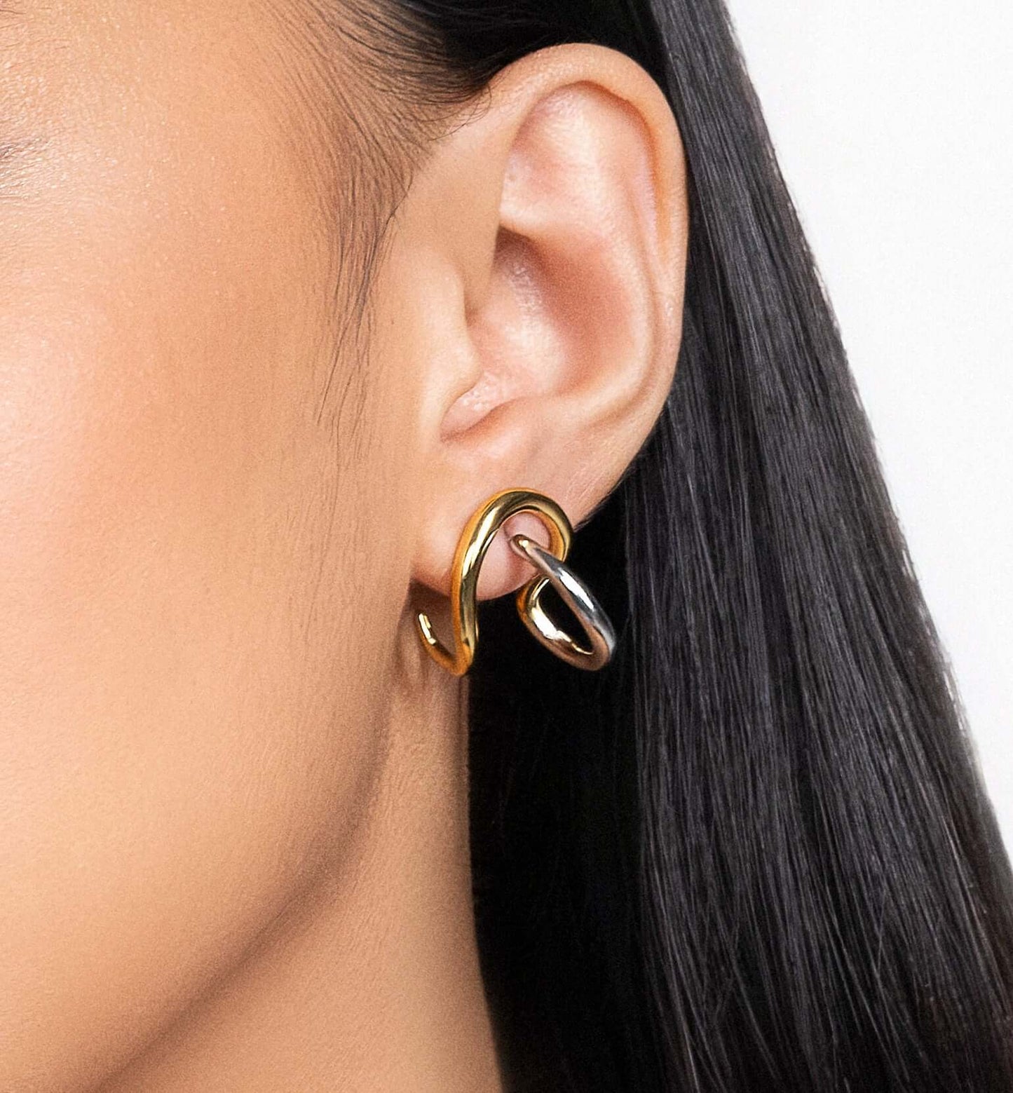 Two tone sculptural stud earrings in gold and silver finish, modern mixed metal statement earrings for women, abstract chunky stud earrings, contemporary minimalist jewelry, bold everyday earrings for casual or elevated styling