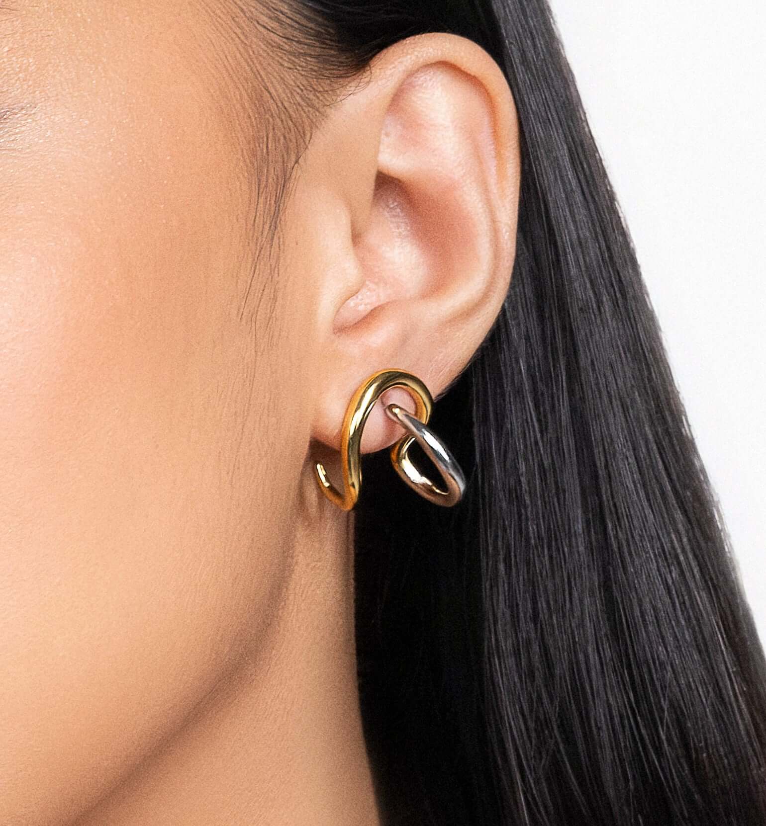 Two tone sculptural stud earrings in gold and silver finish, modern mixed metal statement earrings for women, abstract chunky stud earrings, contemporary minimalist jewelry, bold everyday earrings for casual or elevated styling