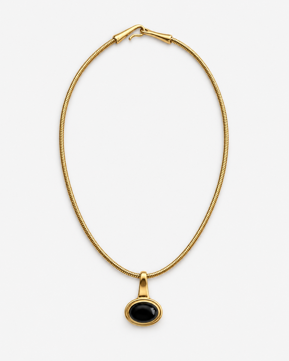 A gold snake chain necklace with a small oval black pendant, displayed against a clean white background.
