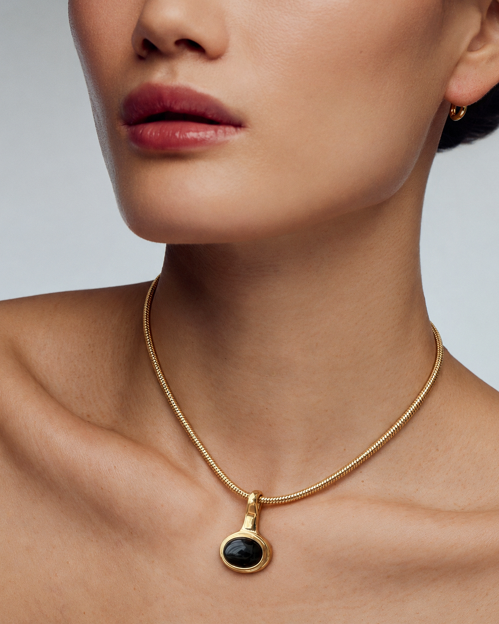 Black Onyx Pendant Necklace in gold or silver with round black stone pendant and sleek snake chain, modern sculptural statement jewelry for women