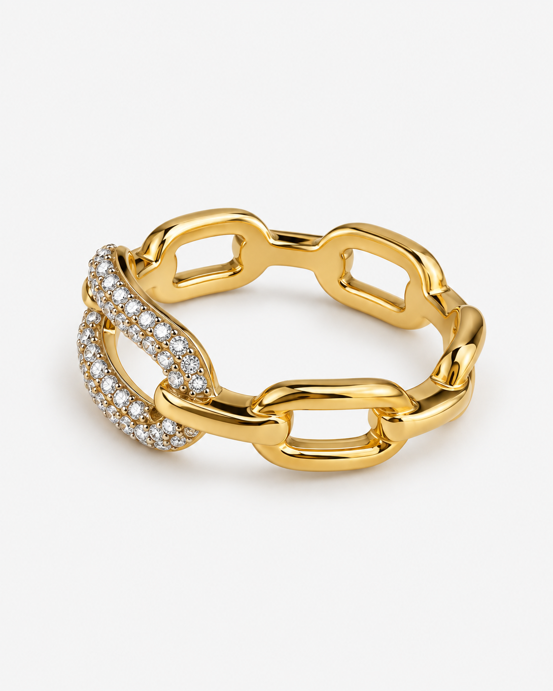 A gold chain-link ring featuring one open link encrusted with small clear pavé stones, photographed on a clean light gray background.