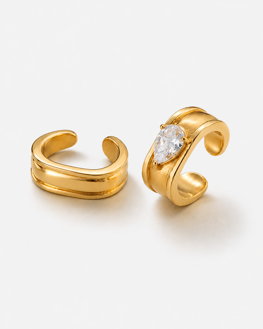 Gold Marquise Ear Cuff Set featuring a sparkling marquise crystal cuff and a matching plain cuff. Non-pierced statement ear cuffs designed for asymmetrical ear stacks, modern styling, and everyday wear.