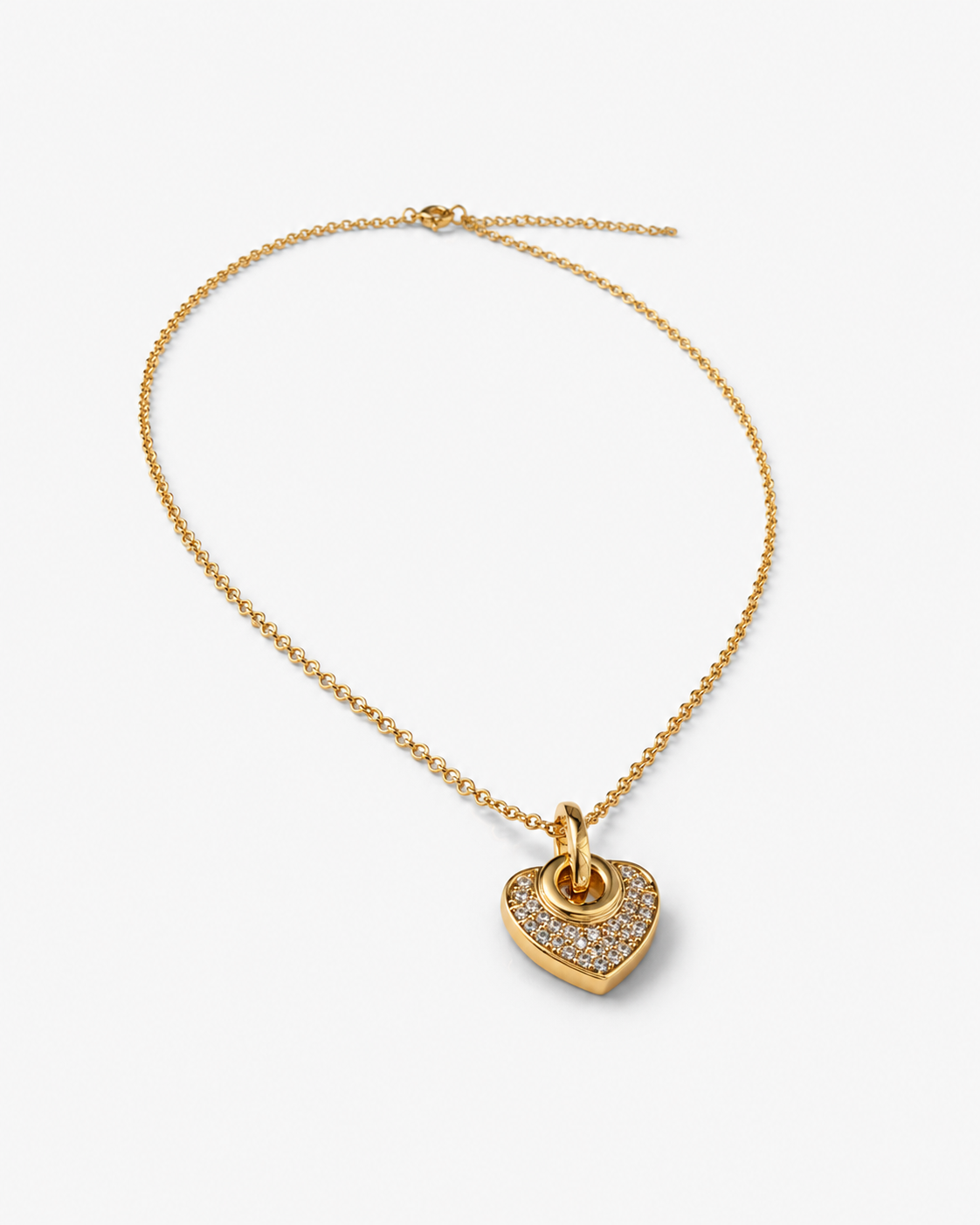 A gold heart pendant necklace featuring a pavé-set clear crystal heart on a delicate gold chain, displayed on a clean white background.
