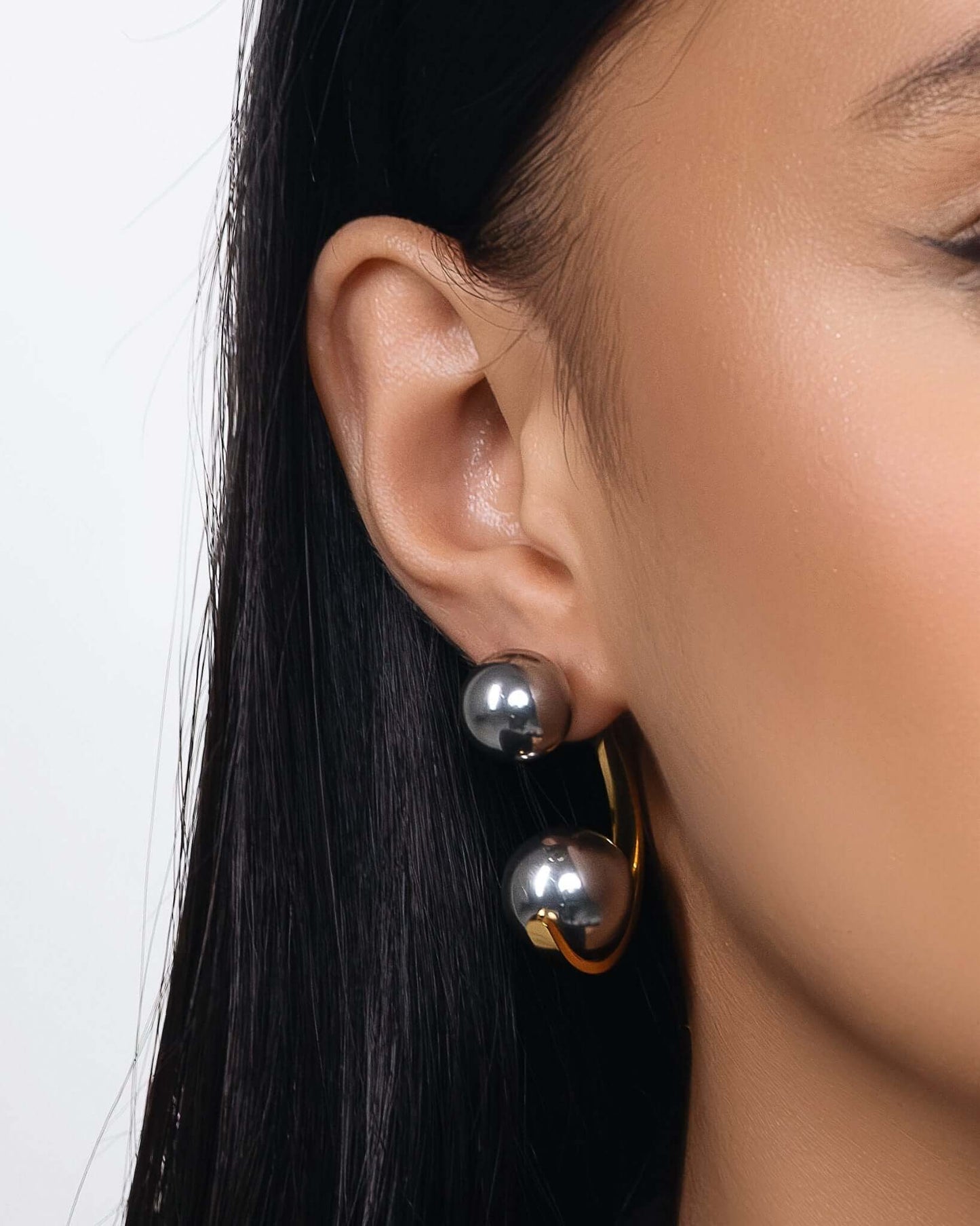 Chunky two tone ear jacket hoop earrings with front and back design in gold and silver, modern statement earrings for women, bold mixed metal hoops, trendy contemporary jewelry for everyday wear or special occasions