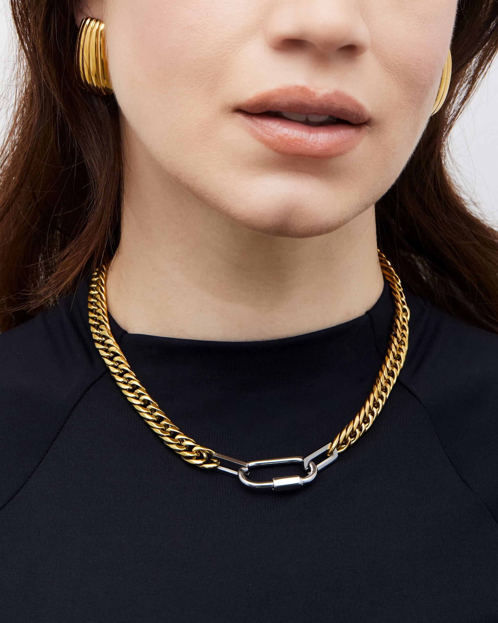 Two-tone chunky Cuban link chain necklace with bold links and pendant attachment, perfect for layering or statement styling.