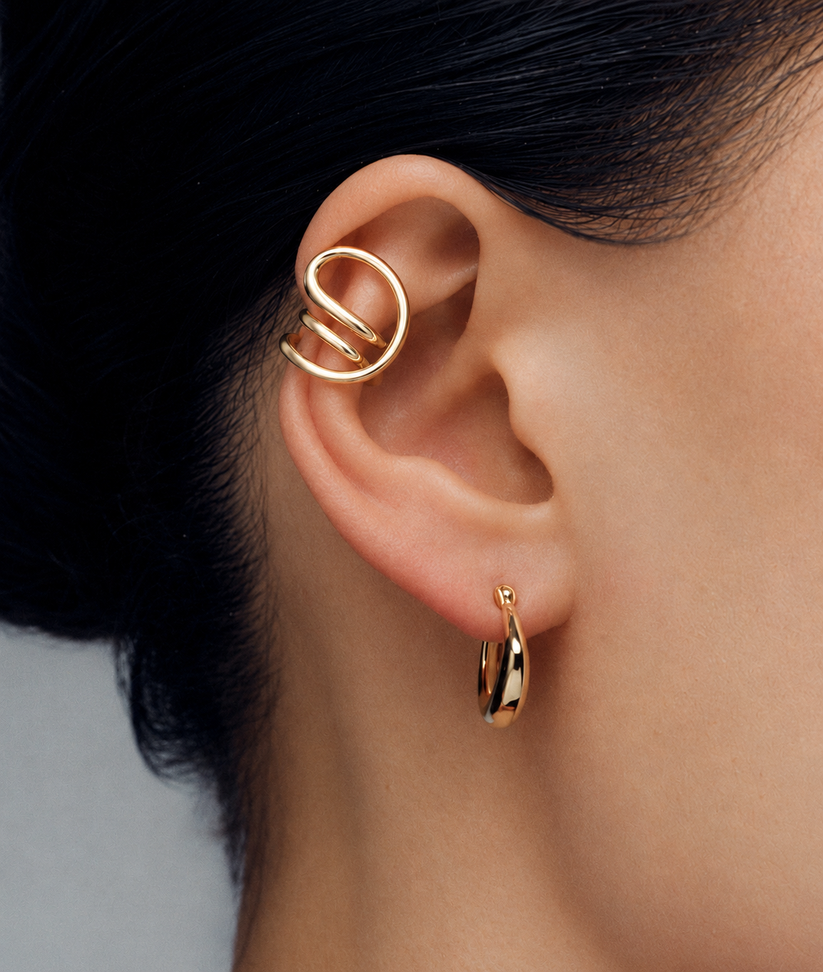 Loop Wrap Ear Cuff in gold or silver with sculptural non pierced open loop design, modern statement ear jewelry for men and women