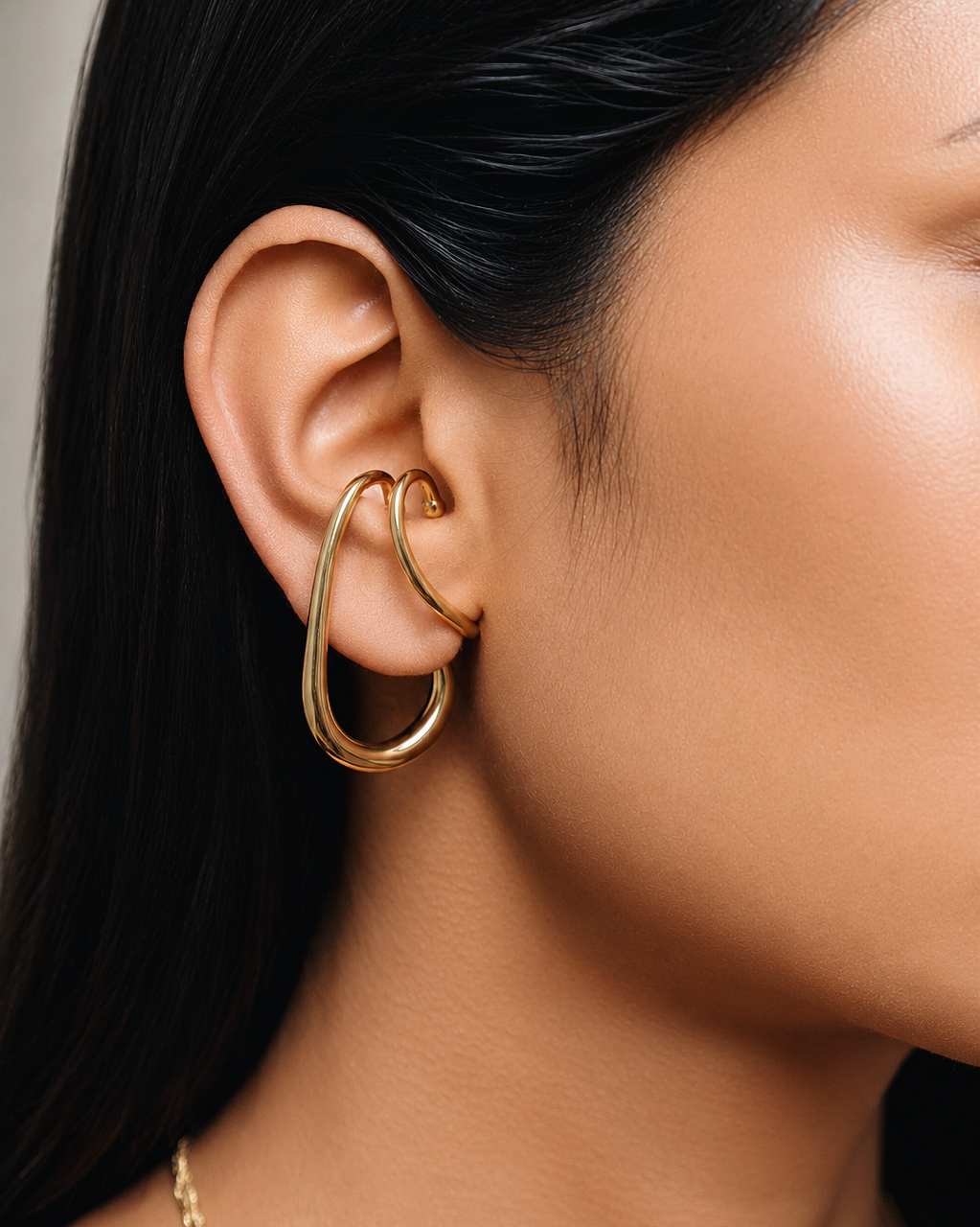 chunky gold hanging ear cuff with oversized teardrop hoop design, no piercing ear cuff earring for women, modern sculptural gold ear wrap jewelry, statement chunky ear cuff with elegant dangle silhouette, waterproof hypoallergenic fashion jewelry for everyday wear and special occasions