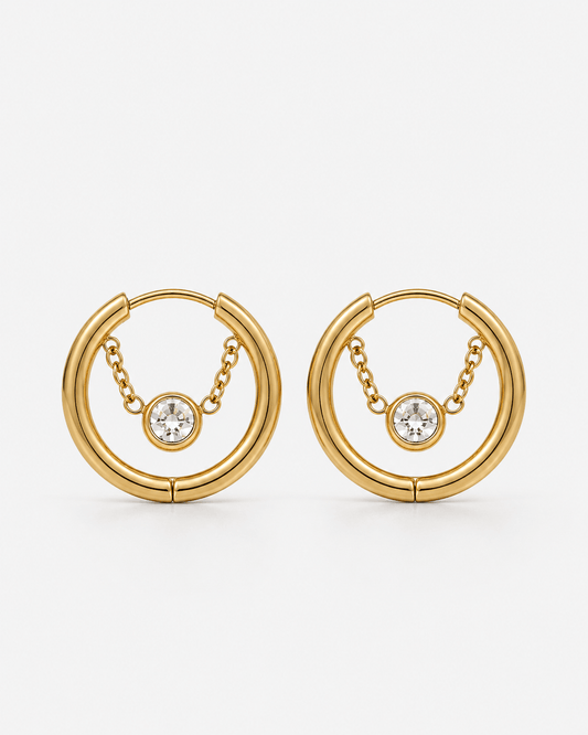Gold crystal hoop chain earrings with dangling clear gemstone detail, modern chunky hoop earrings for women, minimalist statement jewelry, trendy gold hoops with chain accent, elegant everyday or party earrings gift for her