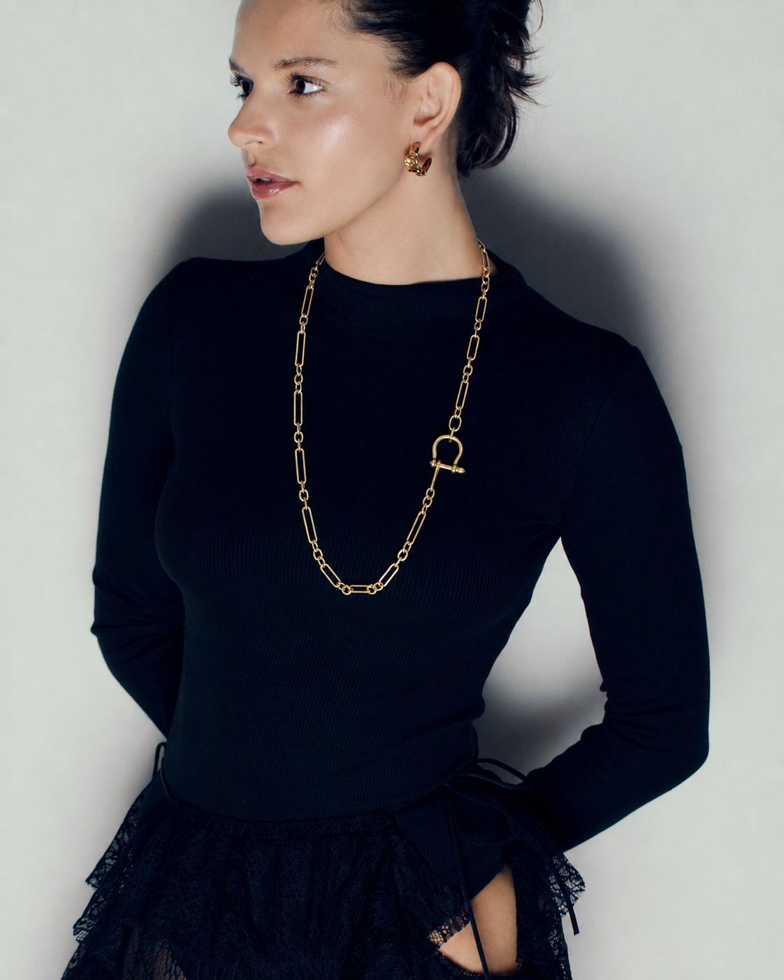 Long link chain toggle necklace in polished gold featuring elongated open links, sculptural horseshoe toggle clasp and versatile long or doubled styling by RRule