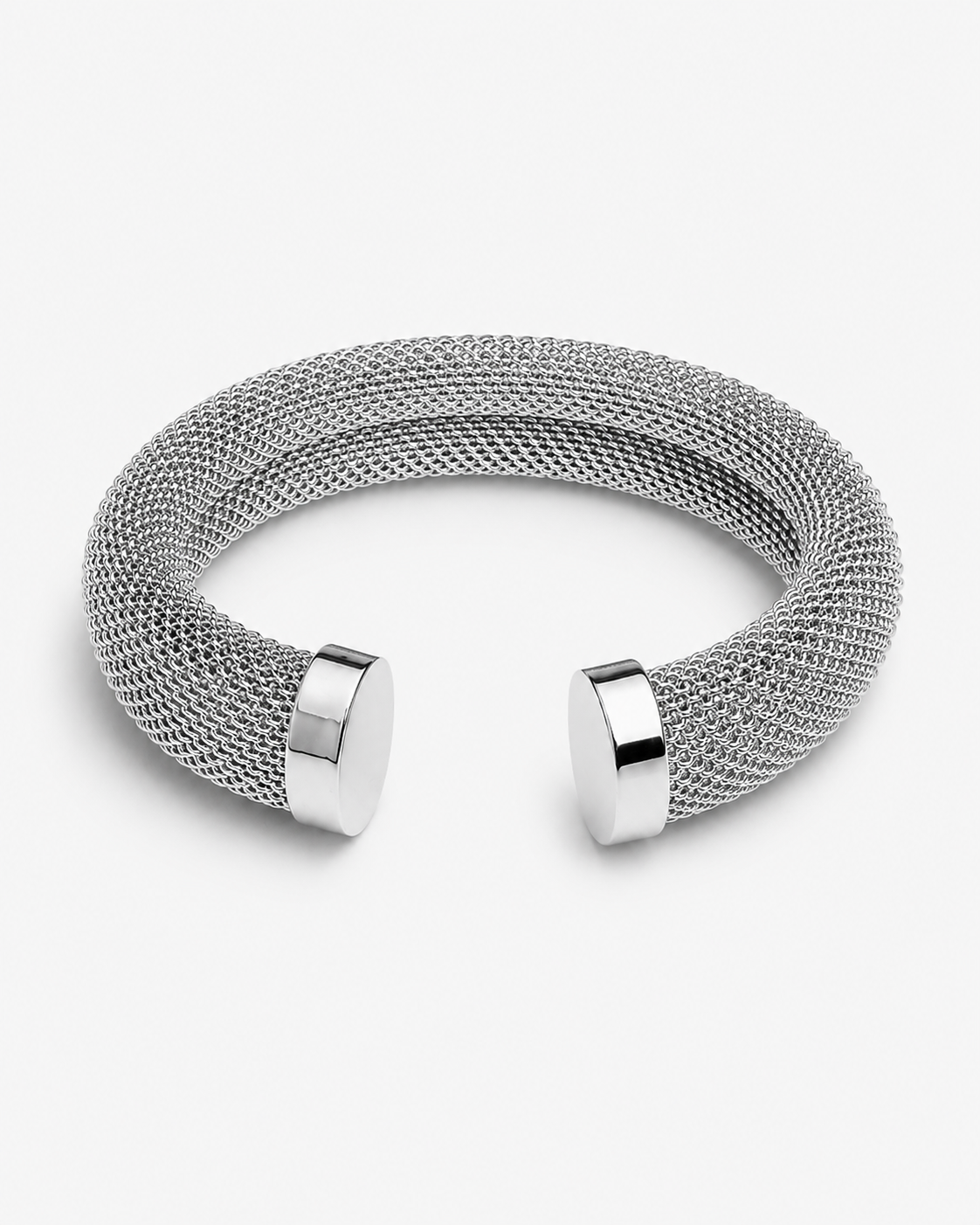 Mesh cuff bracelet close-up showing detailed woven texture, polished metal ends and sculptural open bangle shape