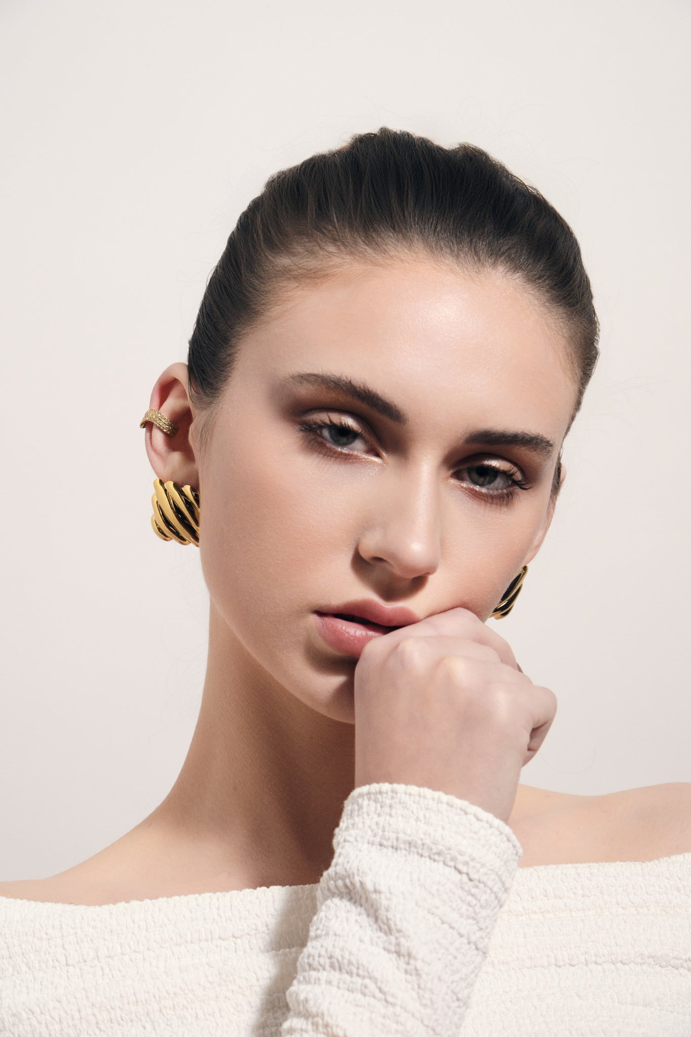 Chunky ribbed gold square stud earrings with sculptural dome design for modern everyday wear.
