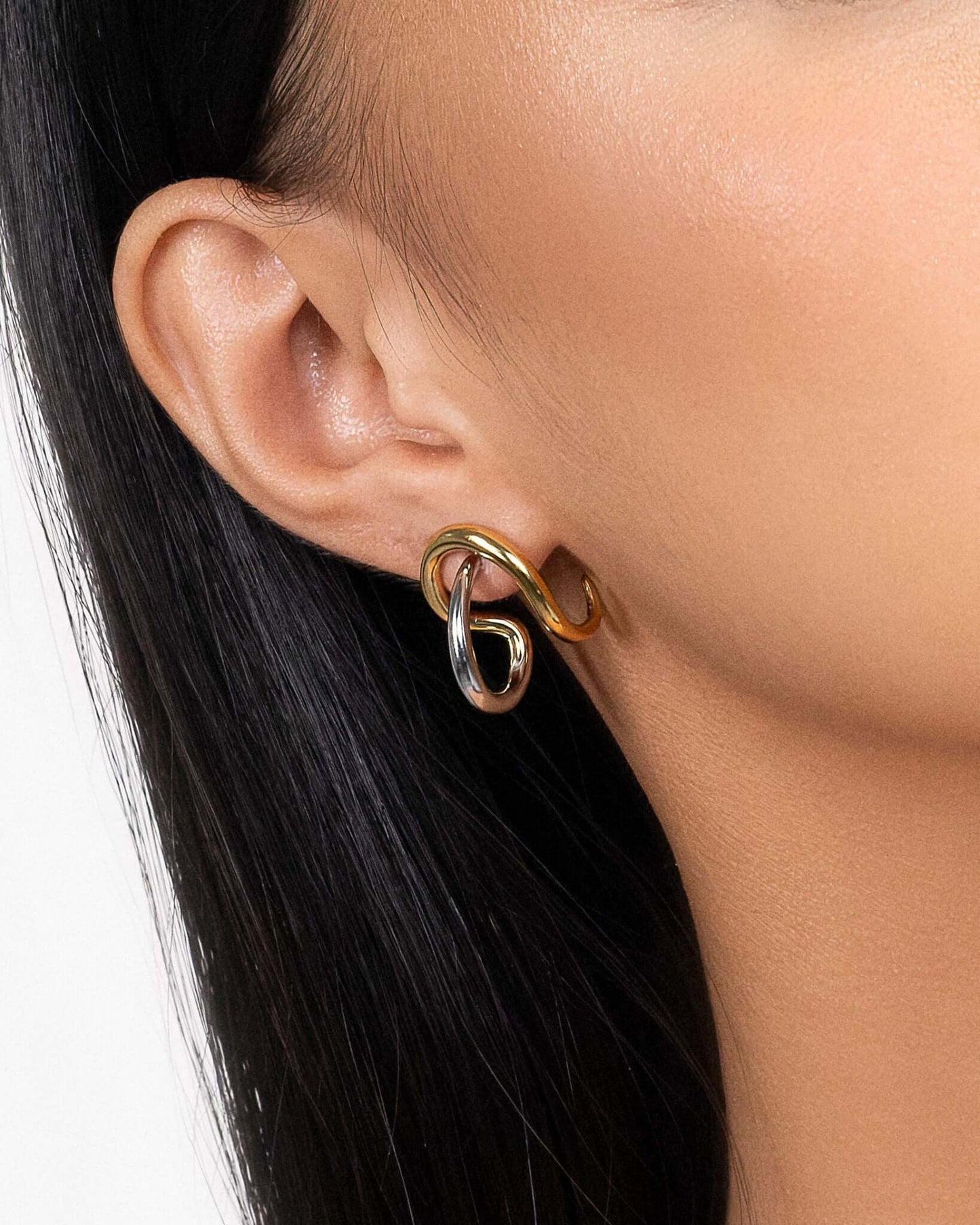 Two tone sculptural stud earrings in gold and silver finish, modern mixed metal statement earrings for women, abstract chunky stud earrings, contemporary minimalist jewelry, bold everyday earrings for casual or elevated styling