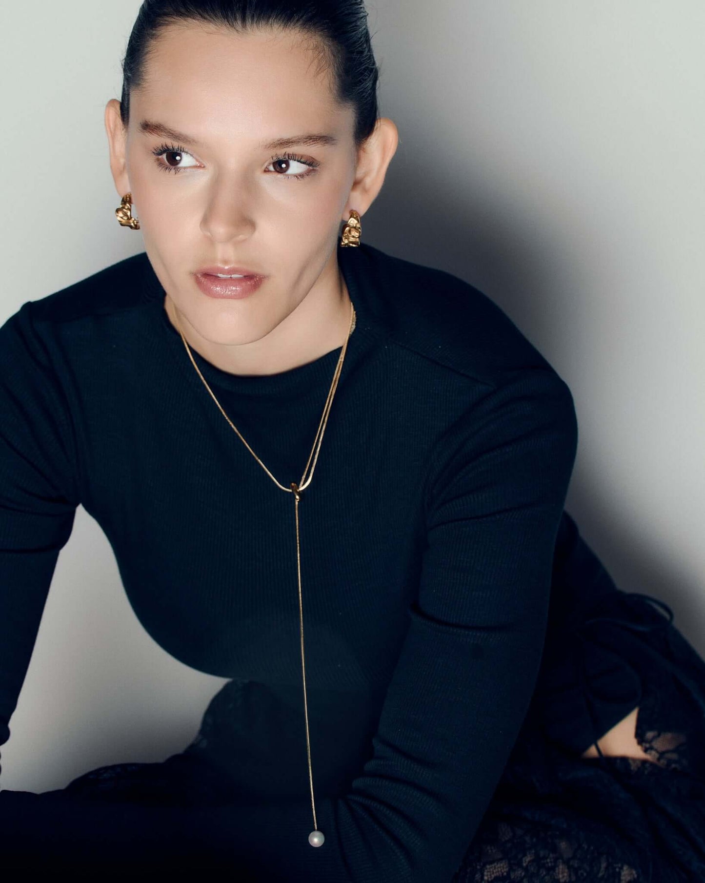 Molten design gold hoop earrings featuring a sculptural, fluid silhouette with polished curves and a high-shine finish. These statement hoops capture the organic flow of molten metal, blending bold form with refined minimalism. Perfect for everyday wear or evening looks, they add effortless sophistication and modern edge to any outfit.