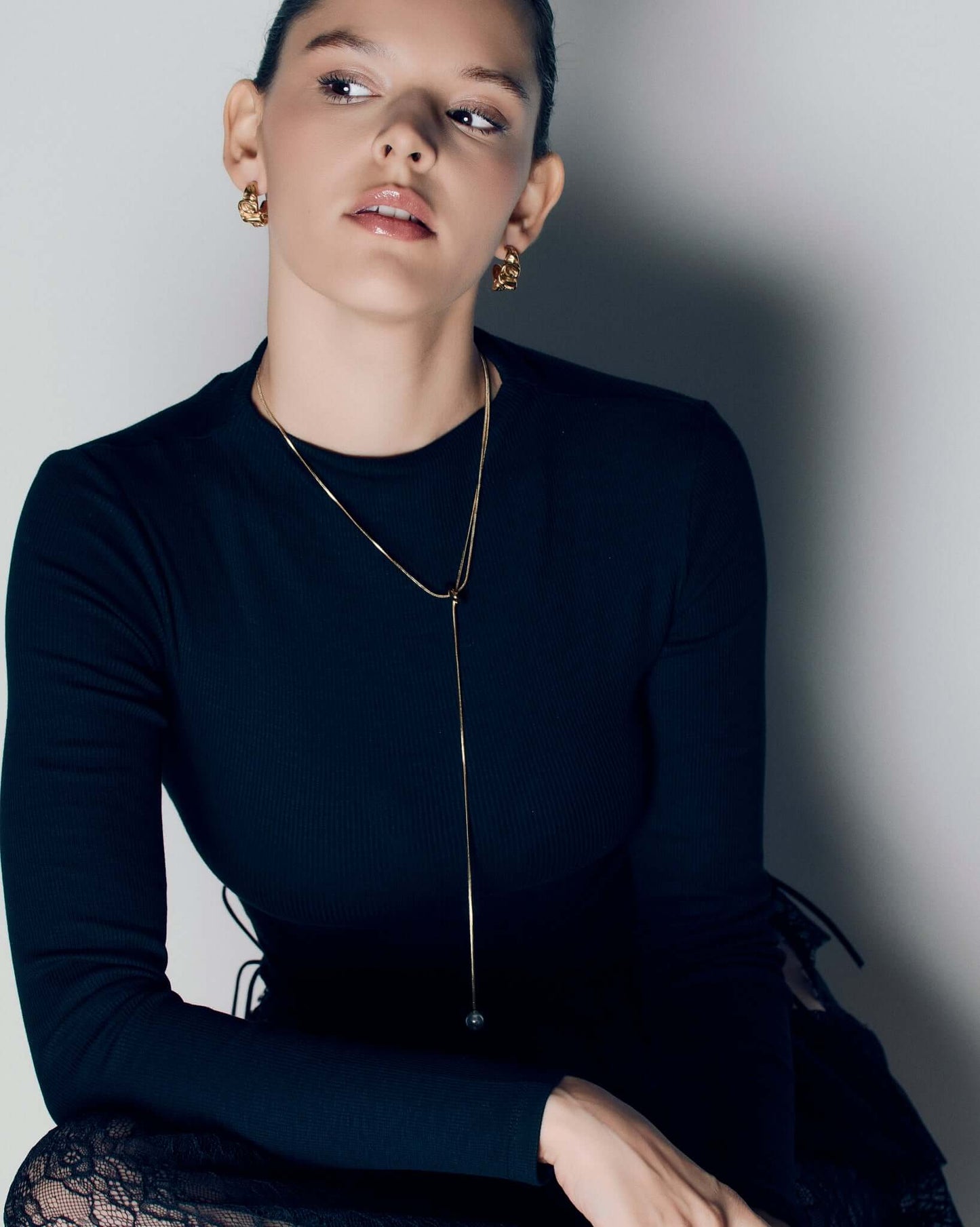 Molten design gold hoop earrings featuring a sculptural, fluid silhouette with polished curves and a high-shine finish. These statement hoops capture the organic flow of molten metal, blending bold form with refined minimalism. Perfect for everyday wear or evening looks, they add effortless sophistication and modern edge to any outfit.