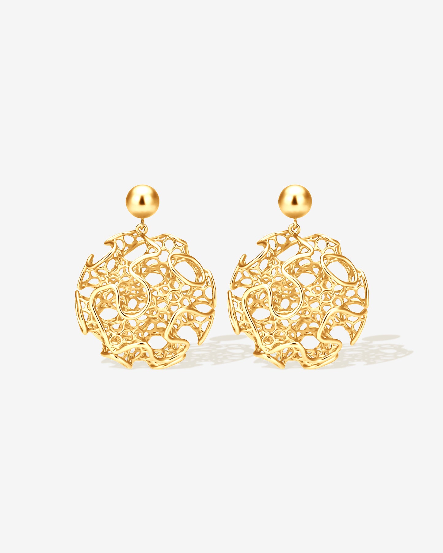 Gold filigree orb statement earrings with intricate openwork lattice design, sculptural modern round dangle earrings for women, bold lightweight statement jewelry, non-tarnish gold-plated stainless steel earrings inspired by architecture and art, contemporary earrings for everyday wear, weddings, parties, and fashion-forward styling.