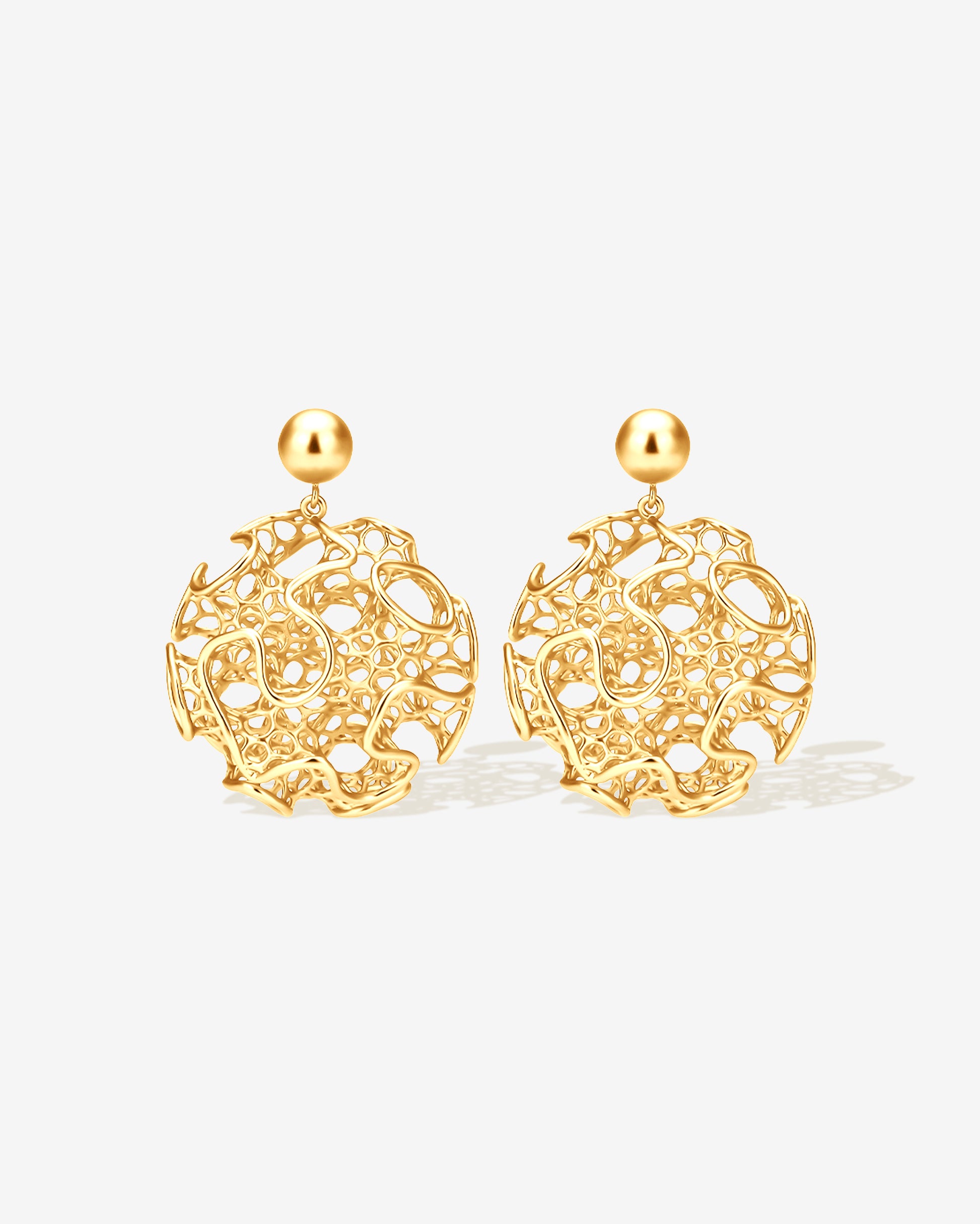 Gold filigree orb statement earrings with intricate openwork lattice design, sculptural modern round dangle earrings for women, bold lightweight statement jewelry, non-tarnish gold-plated stainless steel earrings inspired by architecture and art, contemporary earrings for everyday wear, weddings, parties, and fashion-forward styling.