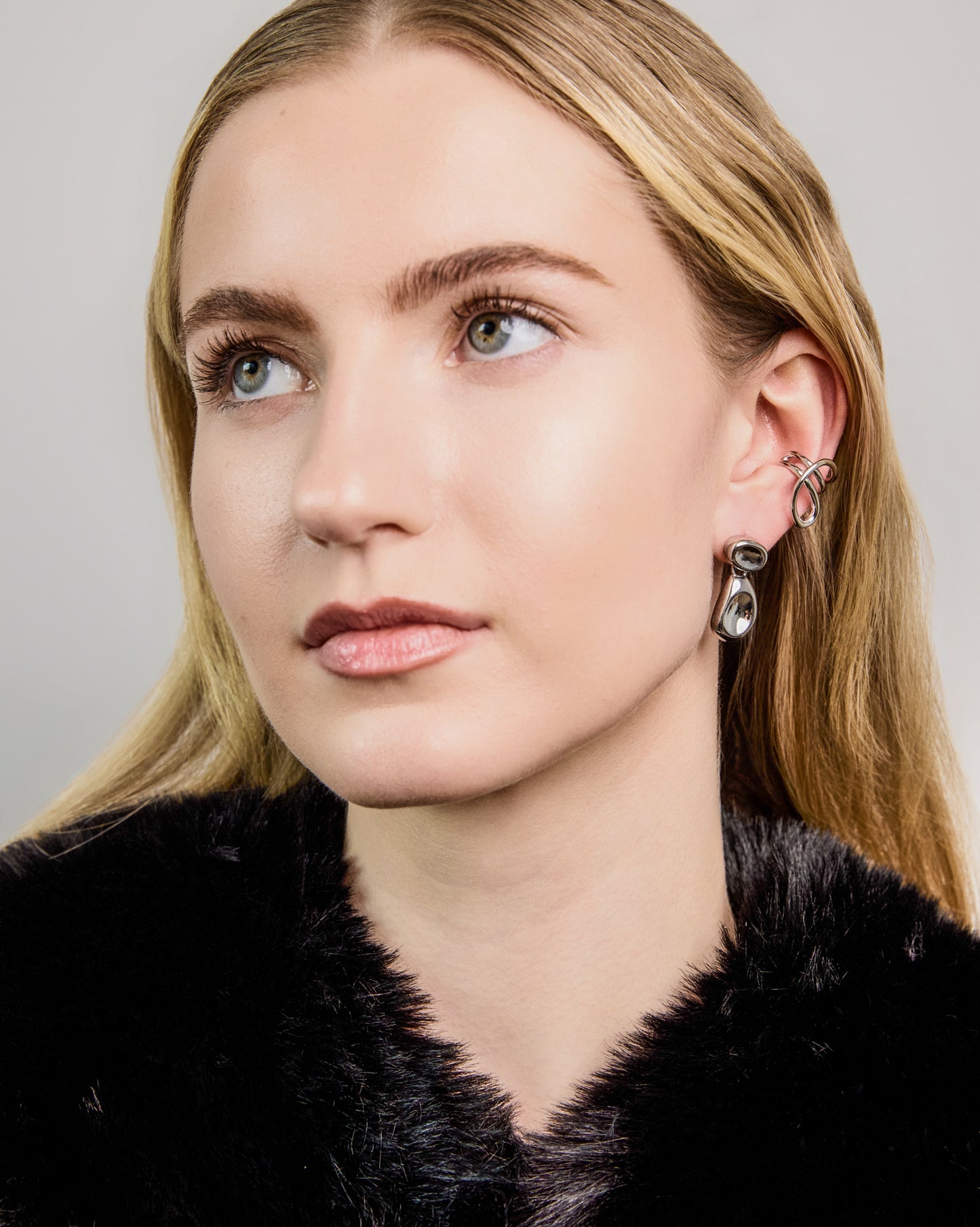 Double Bean Drop Earrings in gold or silver finish featuring a sculptural organic bean design, polished statement drop earrings, modern minimalist jewelry, chunky contemporary earrings for everyday wear and special occasions.