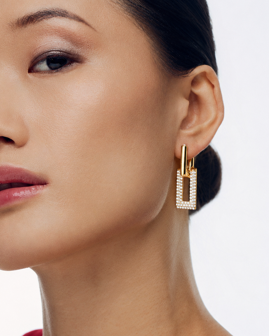 Pavé rectangle drop earrings in gold and silver with crystal-set geometric rectangular drops, polished hoop detailing and modern statement design by RRule
