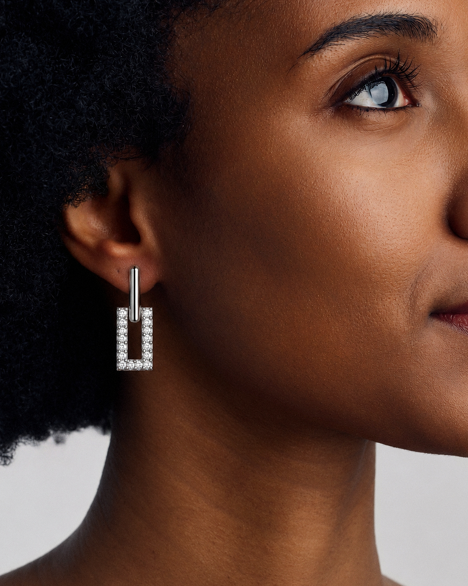 Pavé rectangle drop earrings in gold and silver with crystal-set geometric rectangular drops, polished hoop detailing and modern statement design by RRule