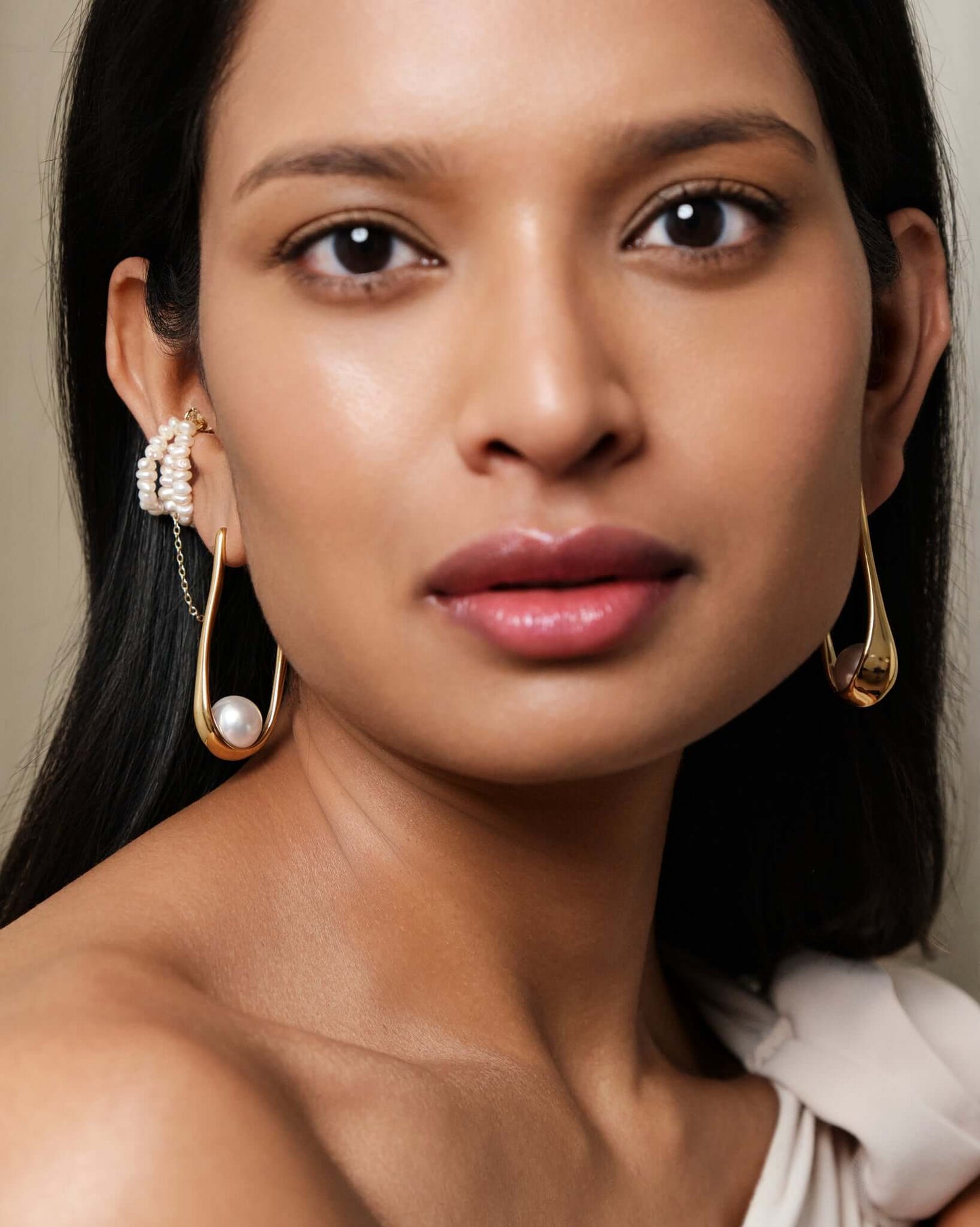 Freshwater pearl ear cuff with gold chain detail, no piercing cartilage cuff worn on ear