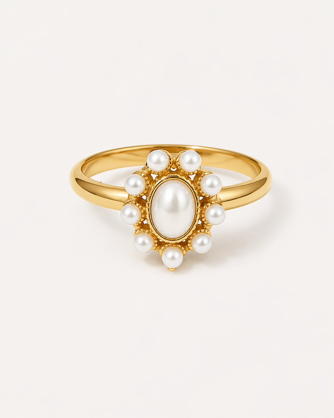 Gold ring featuring an oval white pearl surrounded by a halo of small round pearls, creating a vintage-inspired and elegant design. The polished gold band highlights the soft luster of the pearls, making this dainty pearl ring perfect for everyday wear, special occasions, bridal styling, or gifting. Jewelry product photo on a clean background showcasing the details and craftsmanship.