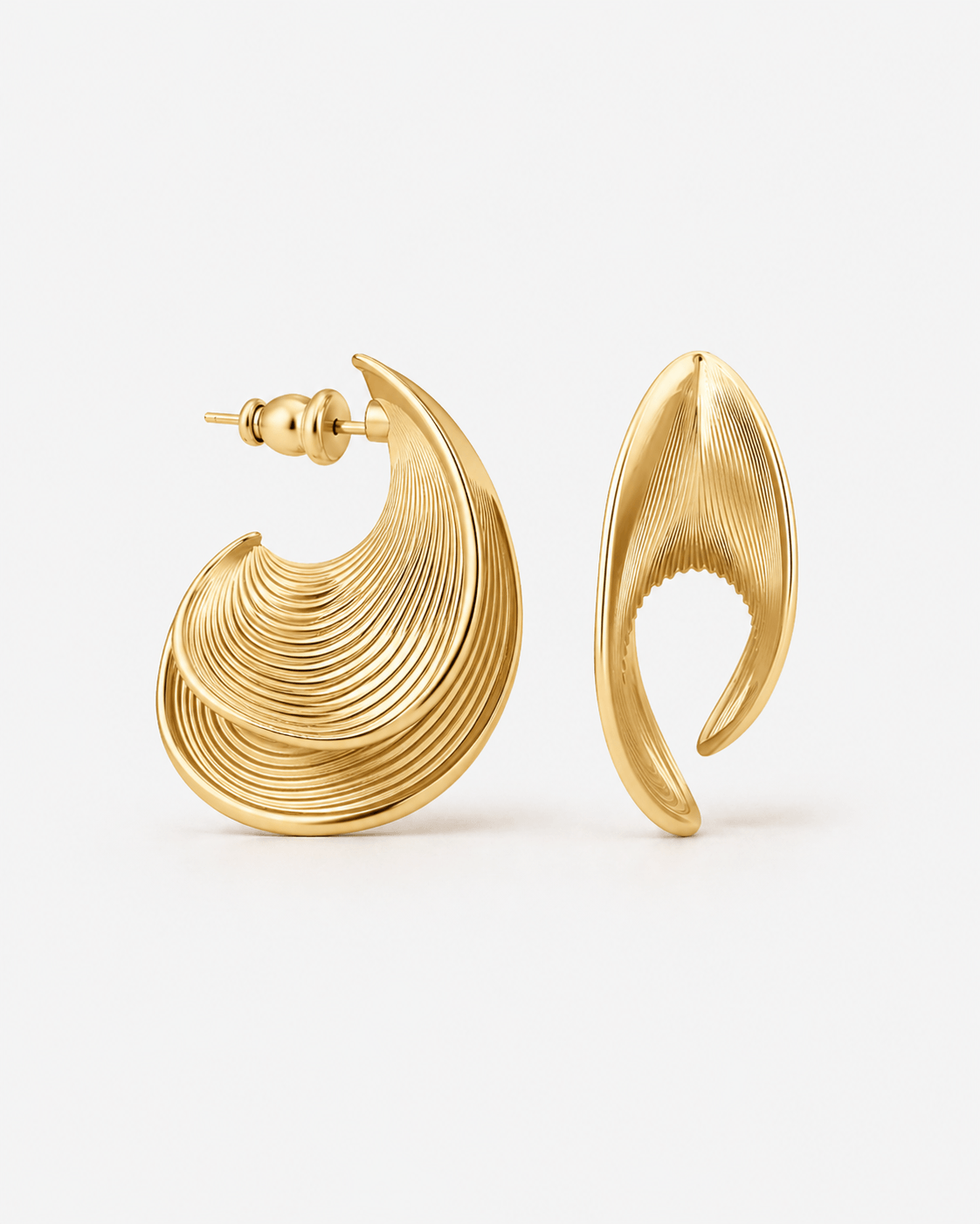 Sculptural ribbed hoop earrings in gold finish, bold textured statement hoops for women, modern curved hoop earrings, contemporary minimalist jewelry, chunky ribbed gold earrings for everyday wear or elevated evening stylingI’m 