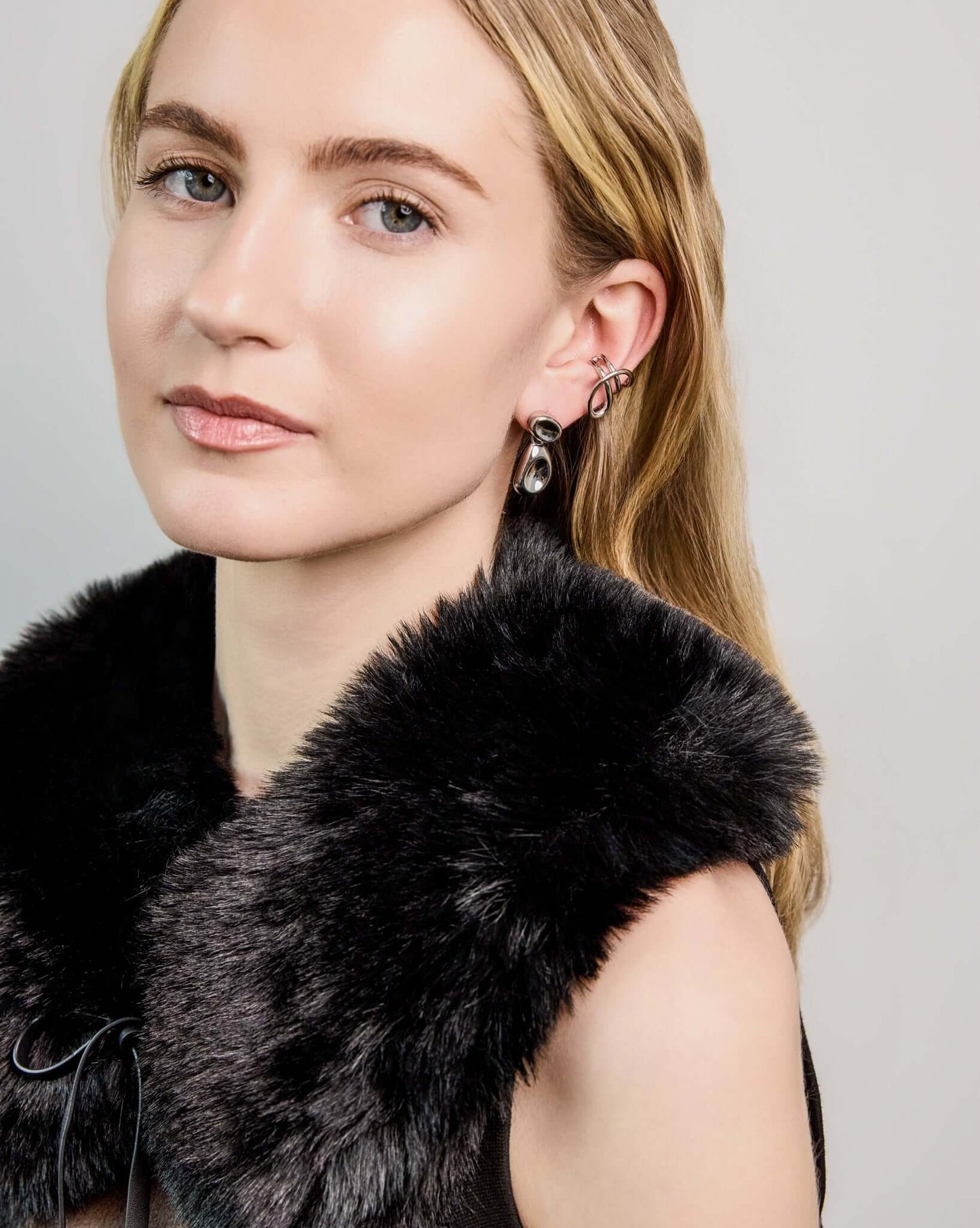 Double Bean Drop Earrings in gold or silver finish featuring a sculptural organic bean design, polished statement drop earrings, modern minimalist jewelry, chunky contemporary earrings for everyday wear and special occasions.
