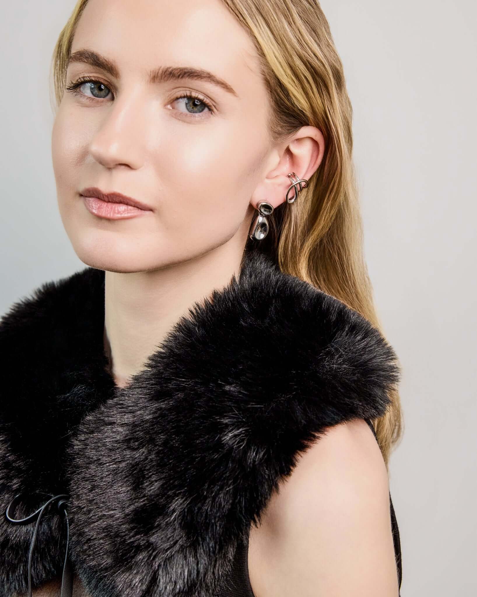 Double Bean Drop Earrings in gold or silver finish featuring a sculptural organic bean design, polished statement drop earrings, modern minimalist jewelry, chunky contemporary earrings for everyday wear and special occasions.
