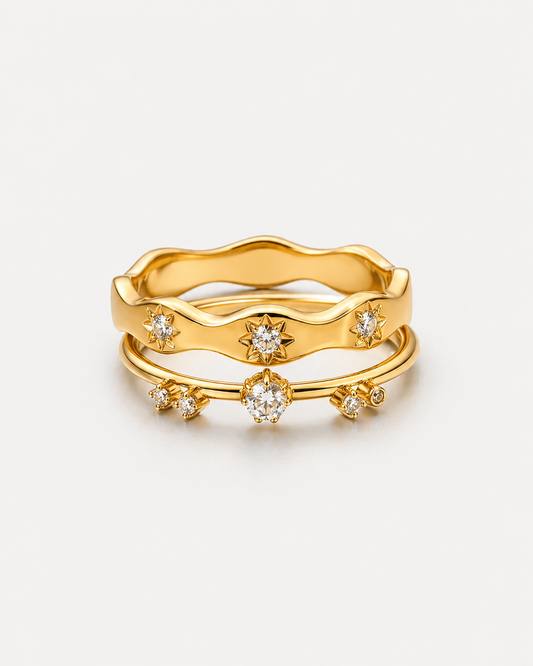 Stacked gold ring set with crystal stones, two matching 18K gold plated stainless steel rings featuring celestial starburst band and open crystal accent ring, minimalist stackable statement jewelry for women, elegant everyday fashion ring set