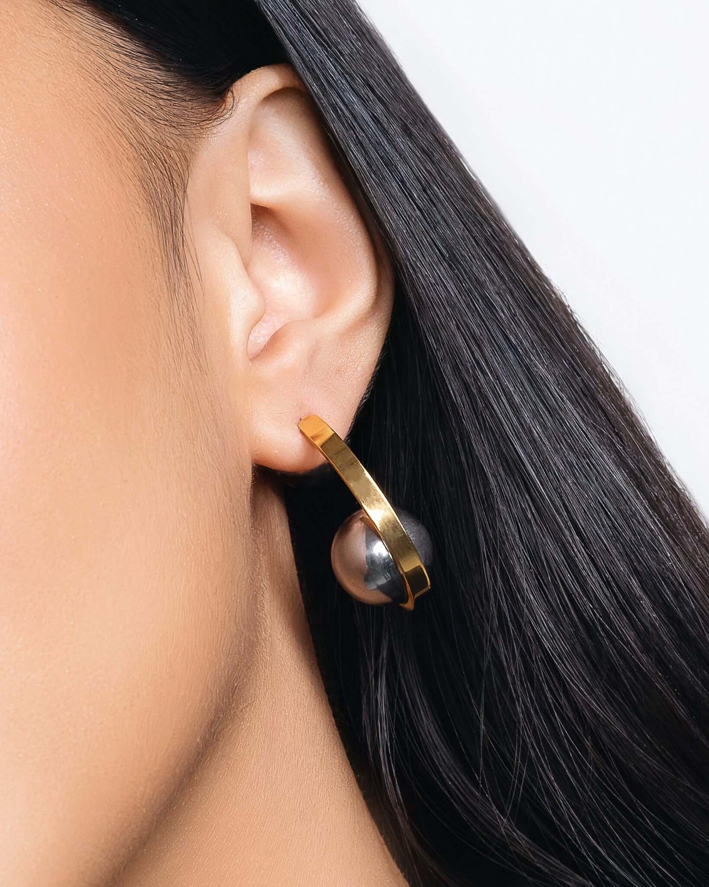 Chunky two tone ear jacket hoop earrings with front and back design in gold and silver, modern statement earrings for women, bold mixed metal hoops, trendy contemporary jewelry for everyday wear or special occasions